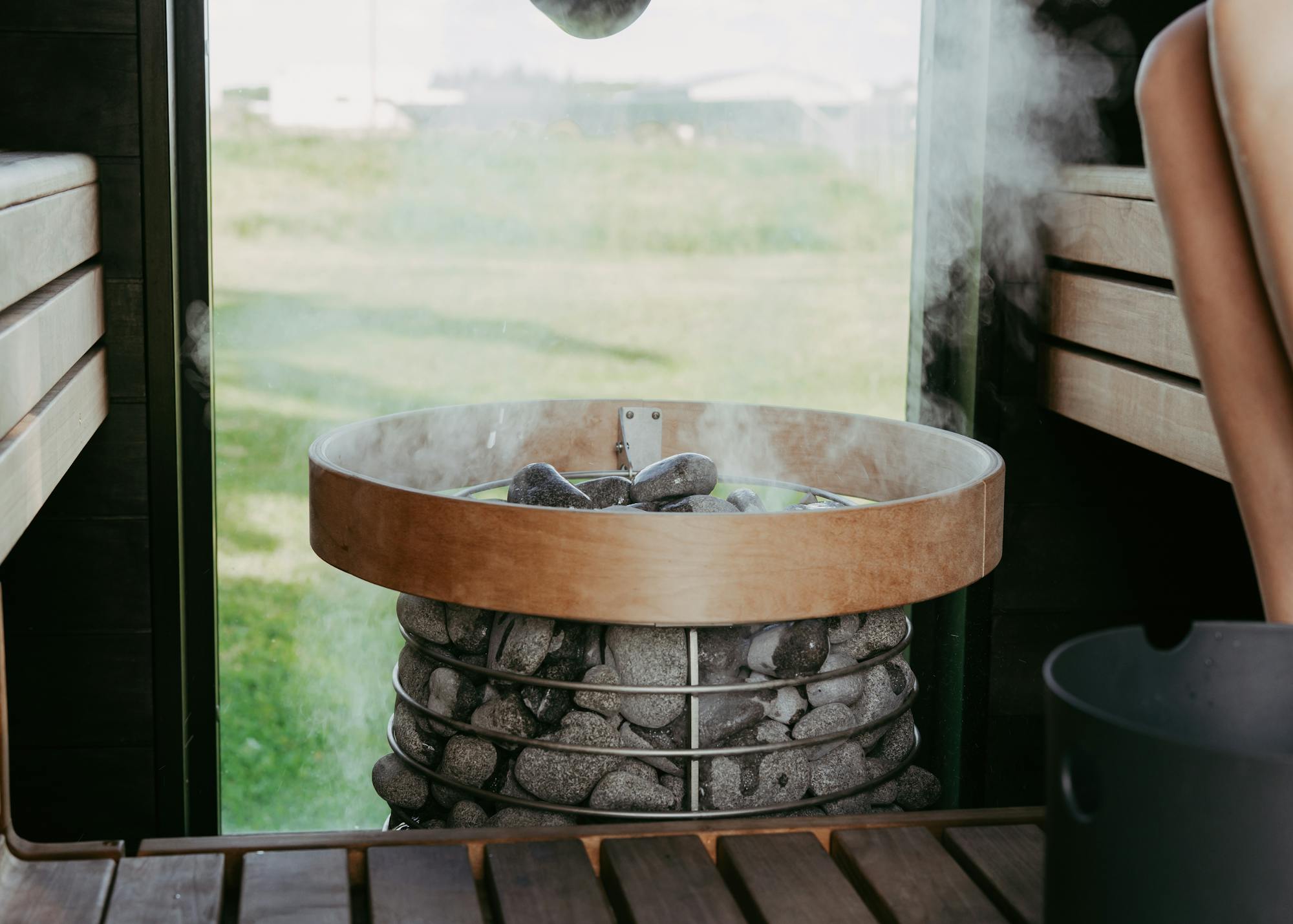 sauna stones with steam coming off of it