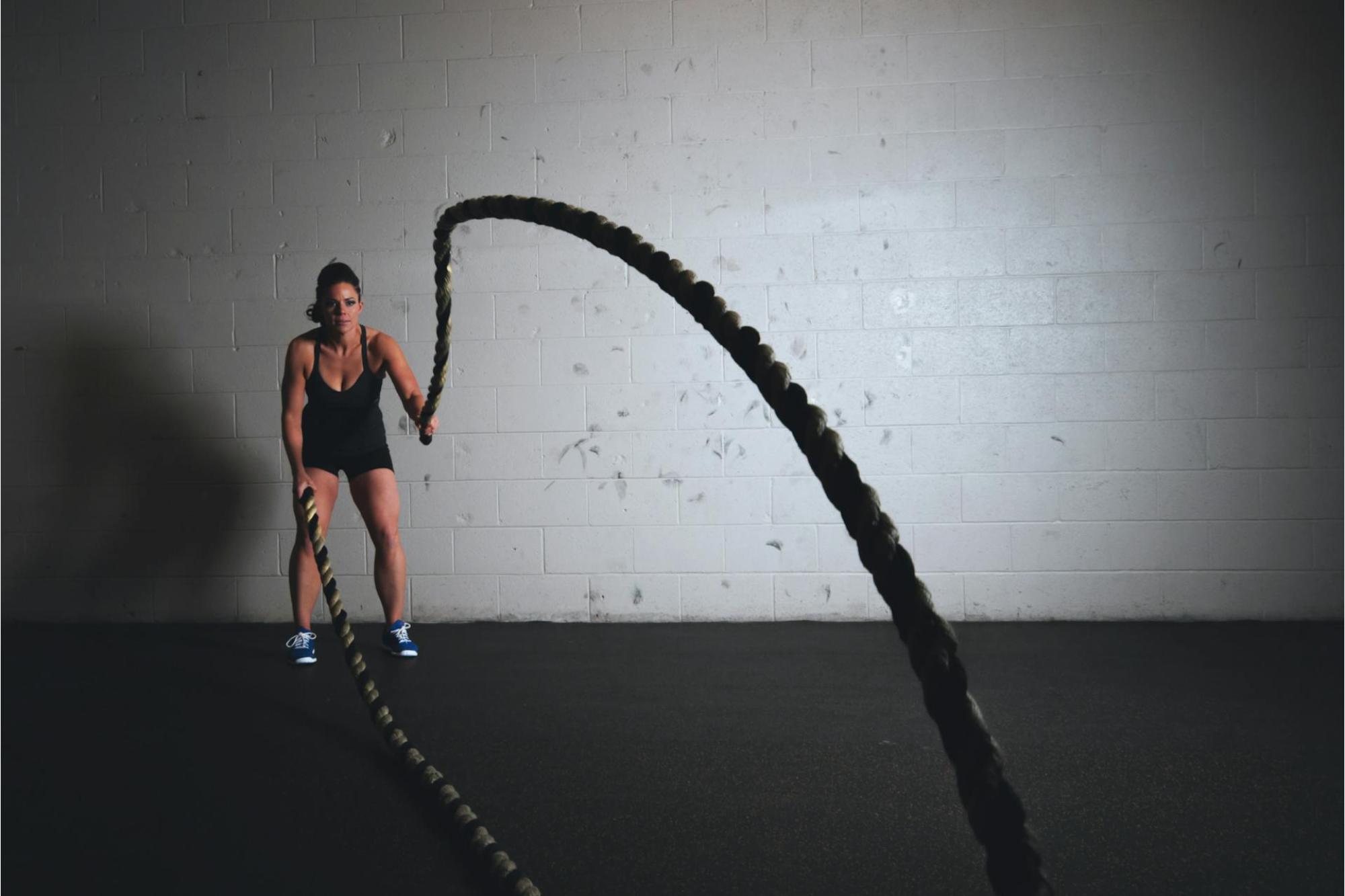 woman training in a gym setting where she has various Fitness Equipment