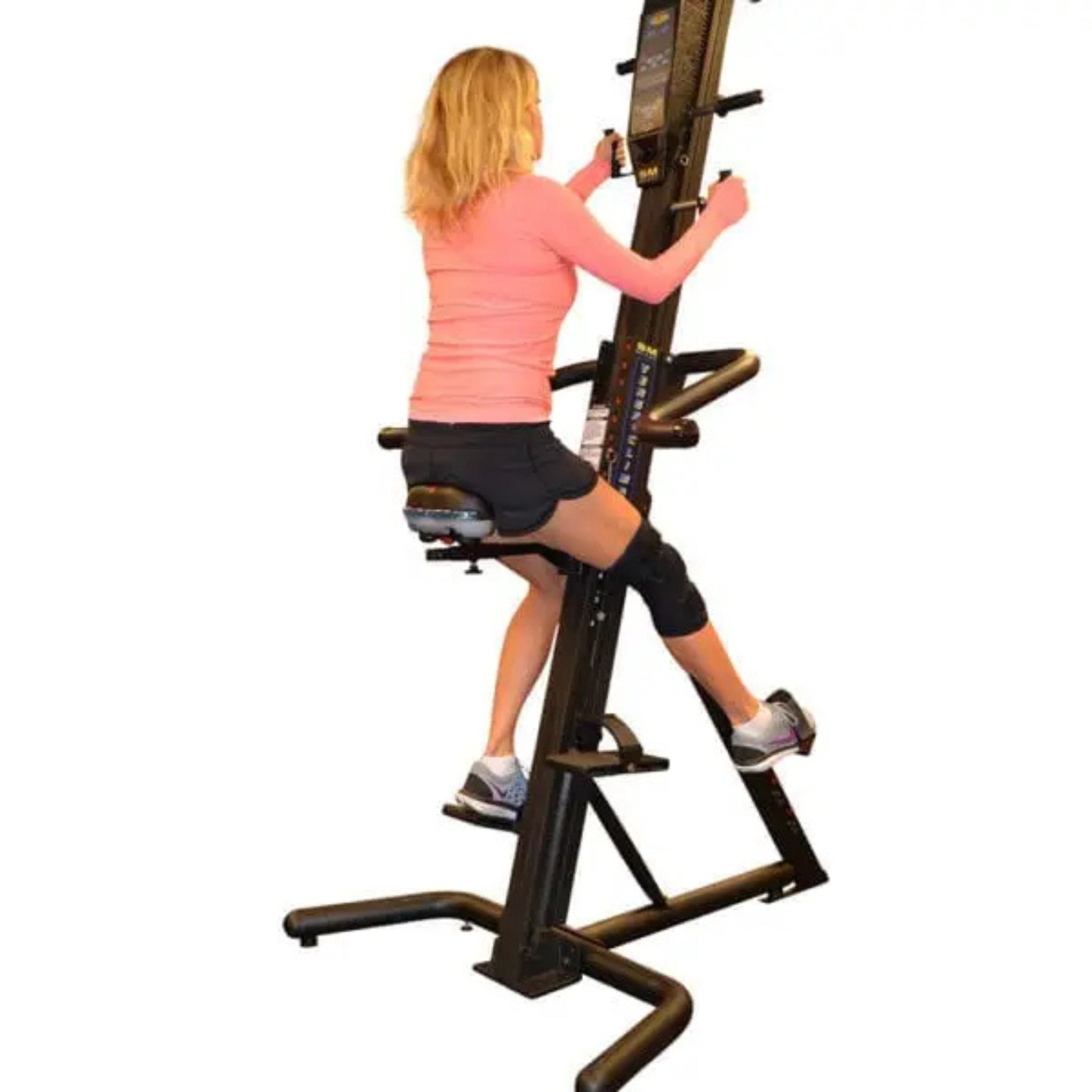 User performing seated workout on VersaClimber with adjustable seat installed