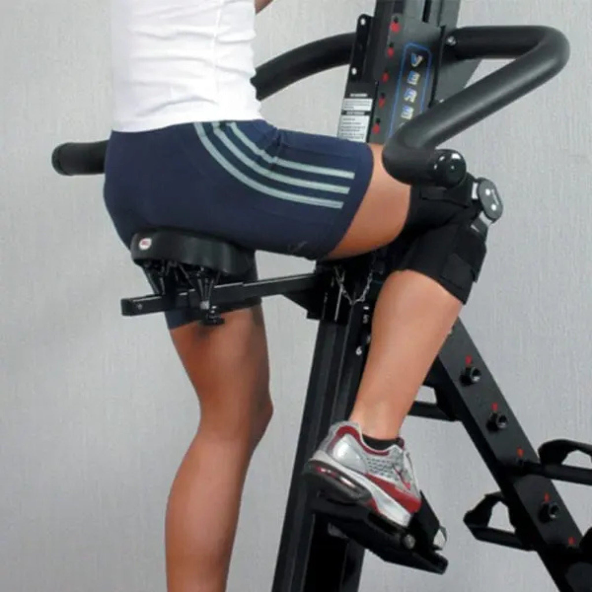 Side view of athlete training on VersaClimber LX or SM with adjustable seat attachment