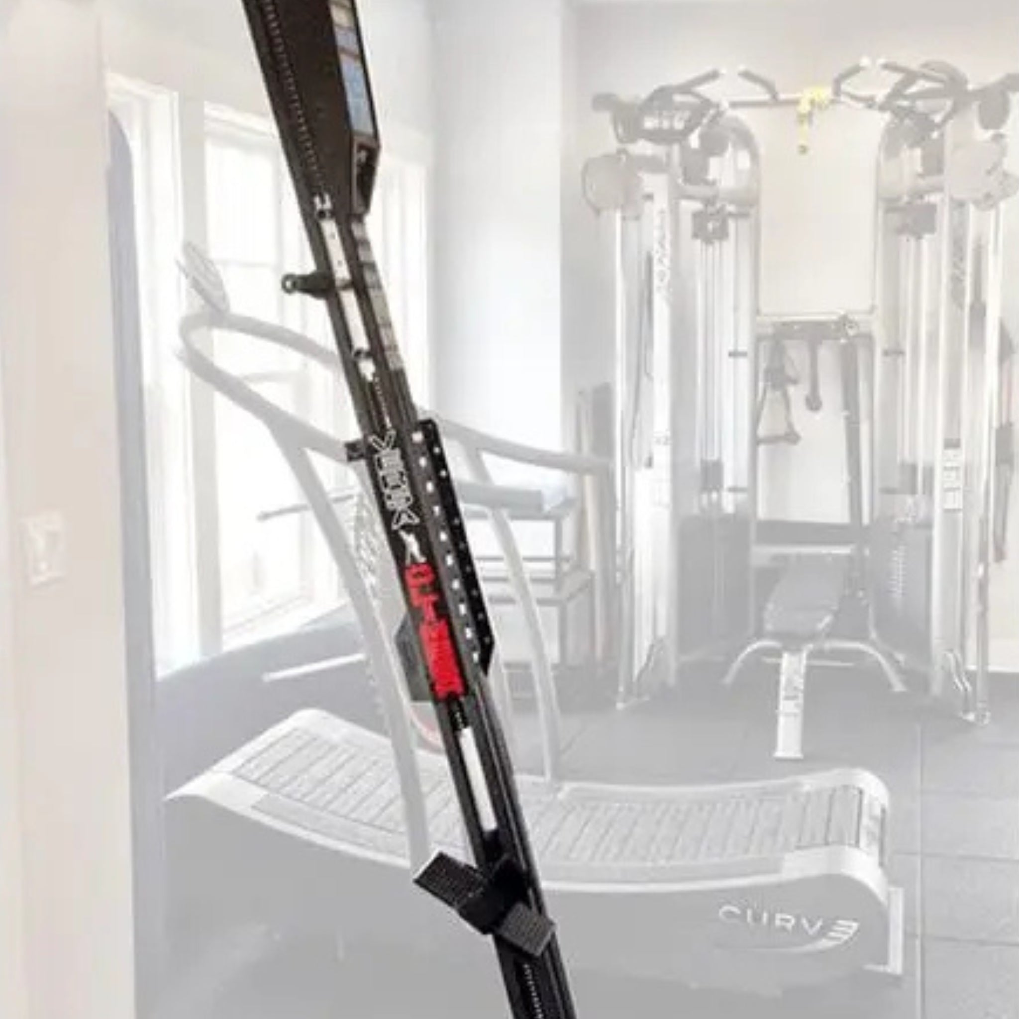 VersaClimber machine mounted on wall using bracket system in a gym setting