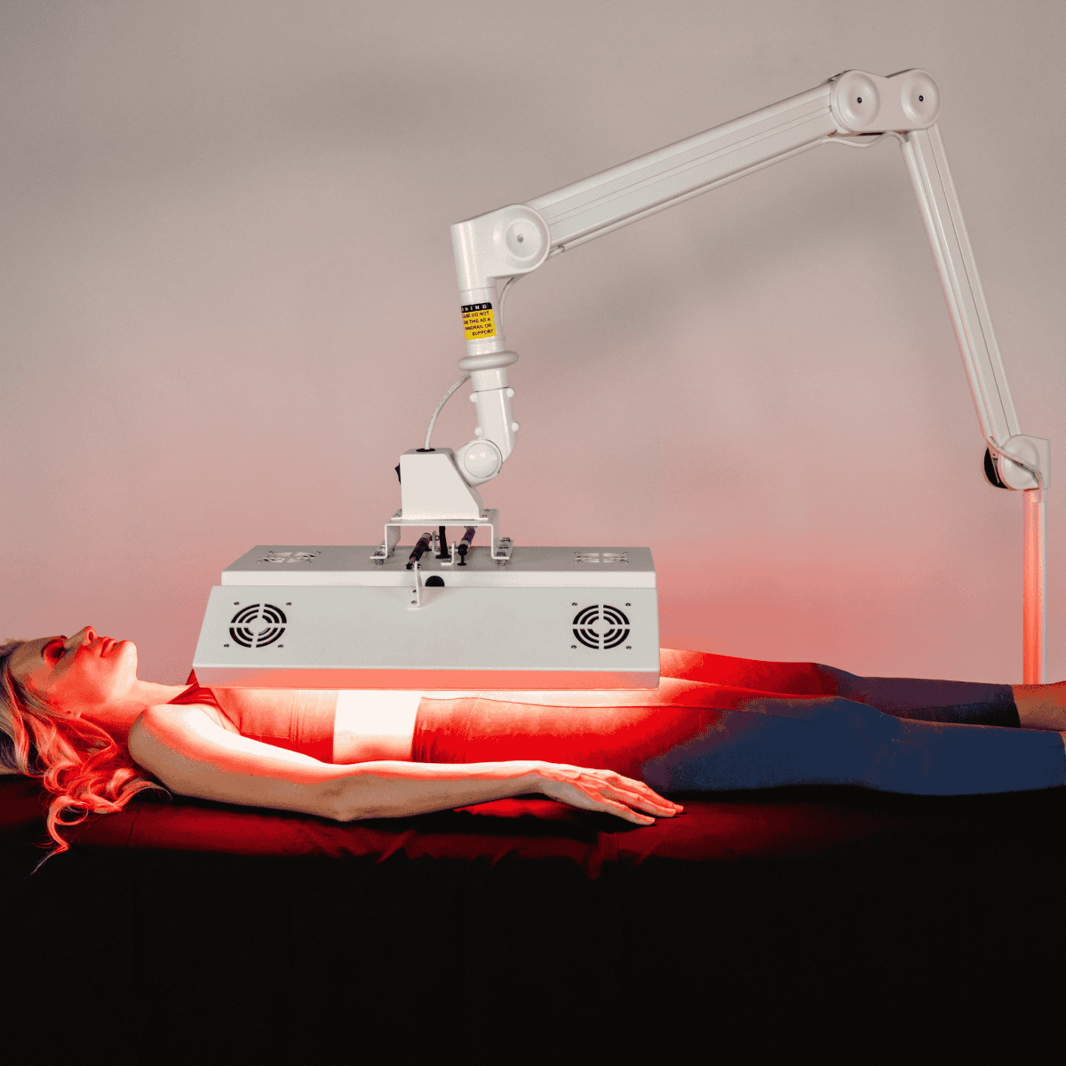 ApolloARC Premier Red Light Therapy System with adjustable arm for skin rejuvenation and recovery.