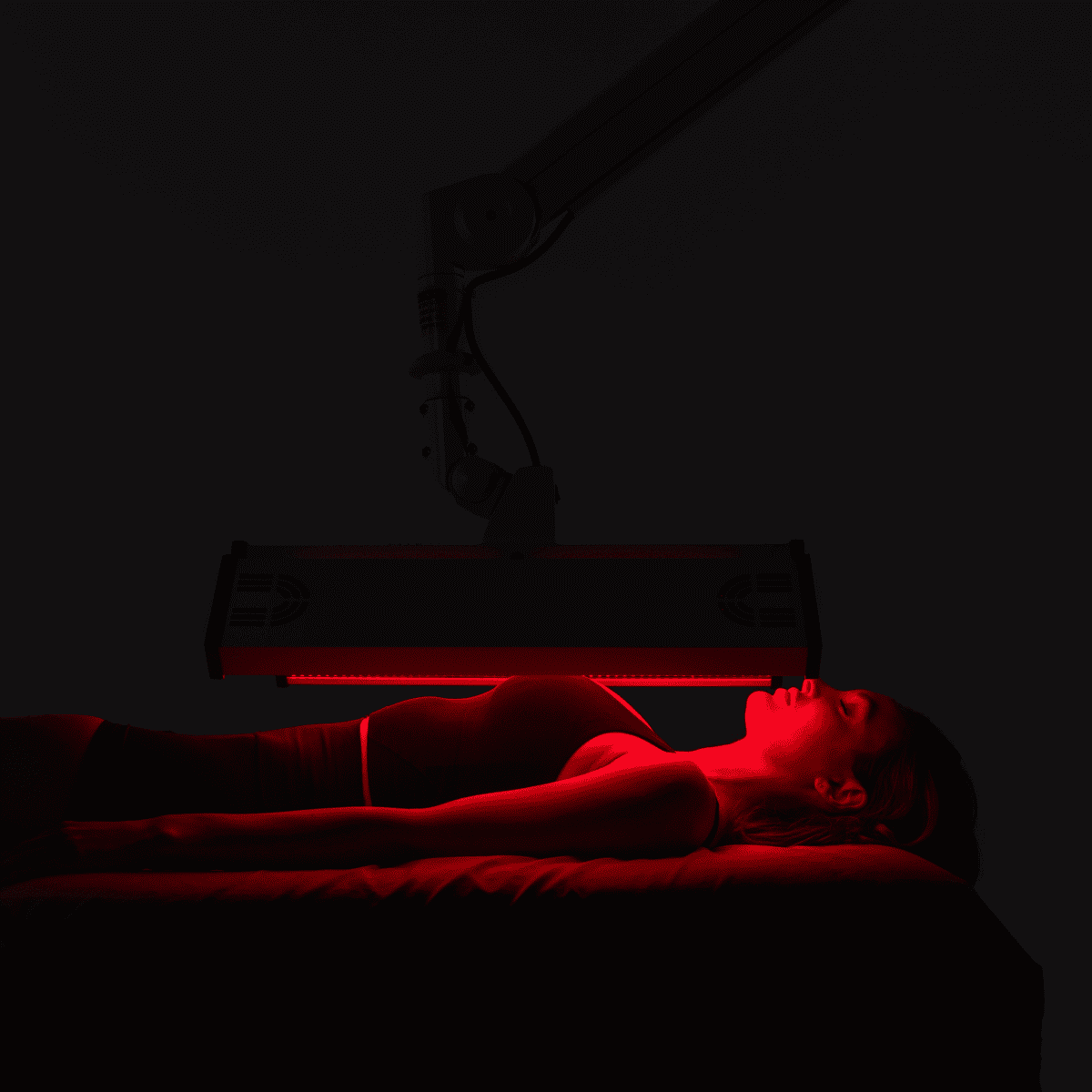 ApolloARC Premier Red Light Therapy System with adjustable arm for skin rejuvenation and recovery.