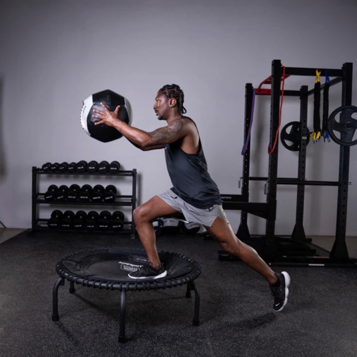 Woman exercising with Dynamax medicine ball for core and functional fitness
