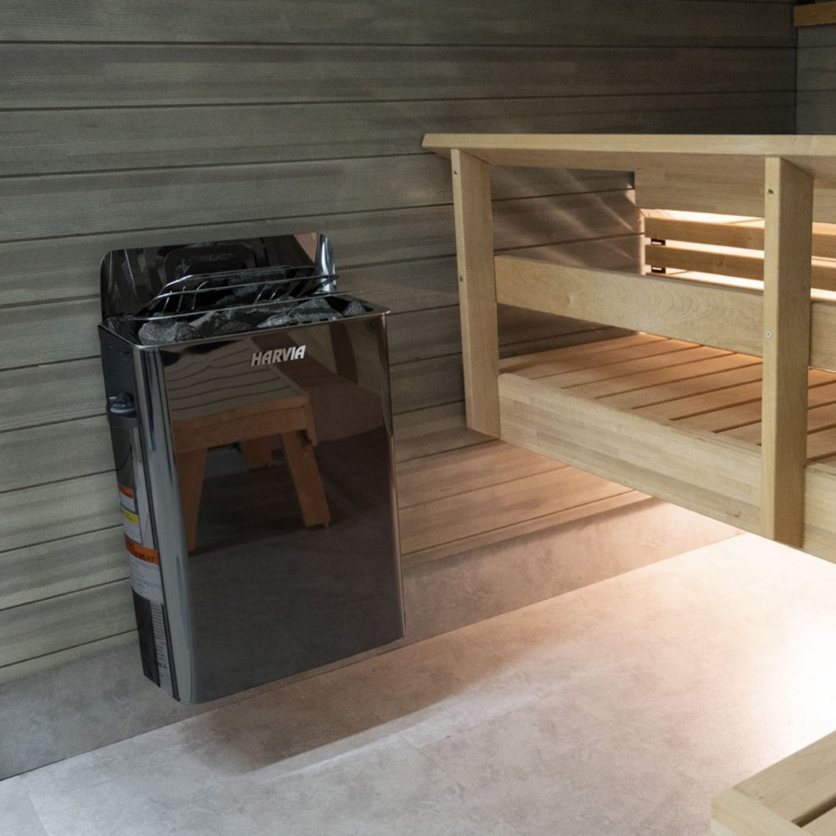 Harvia The Wall SW80 sauna heater installed inside a traditional wood sauna