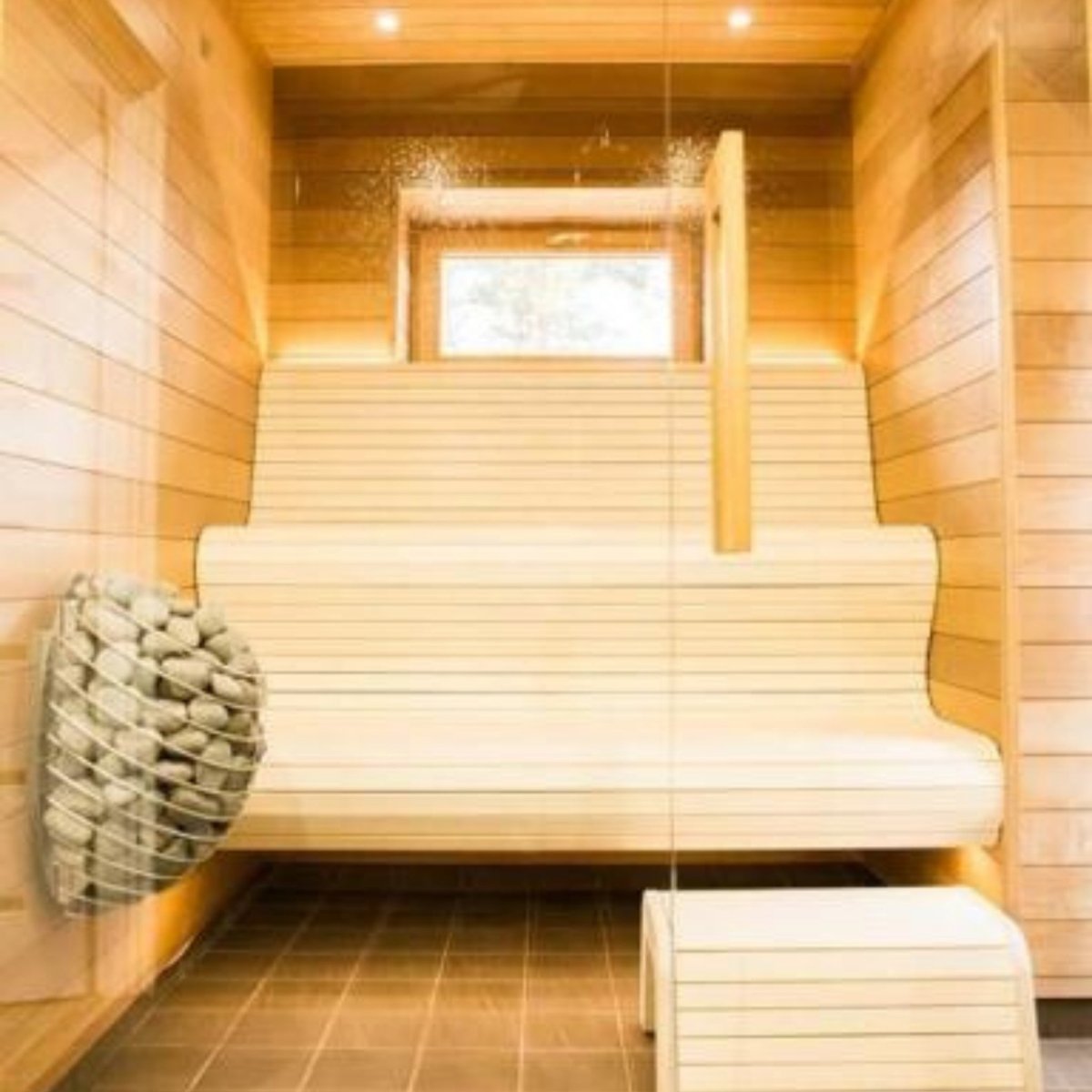HUUM DROP 7.5 sauna heater beside wooden sauna bench