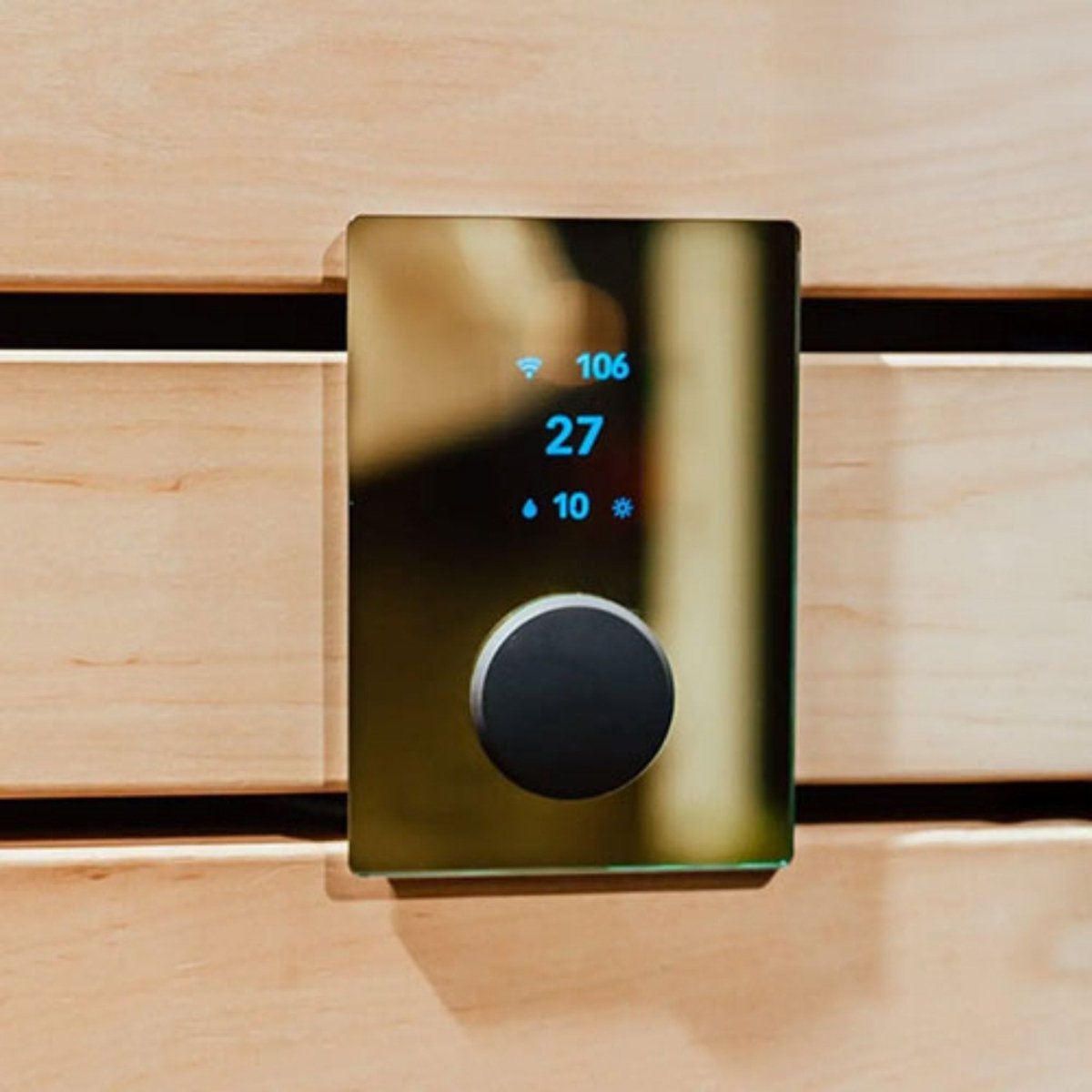 HUUM UKU Gold sauna controller installed in wood sauna wall
