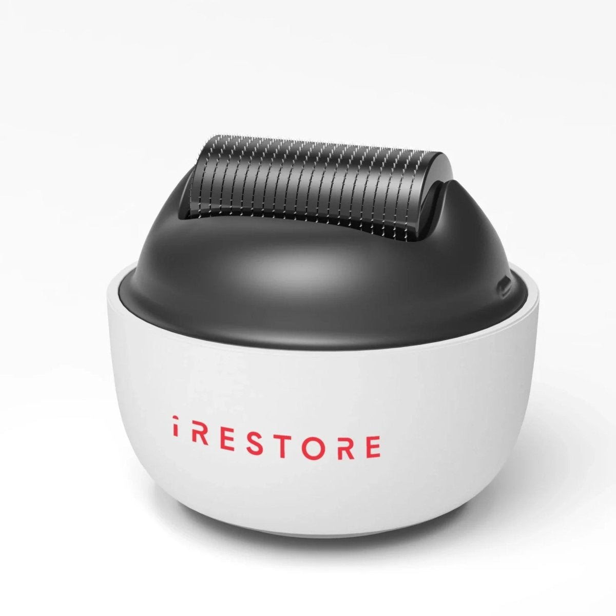 Close-up view of iRestore scalp massager with ergonomic handheld design