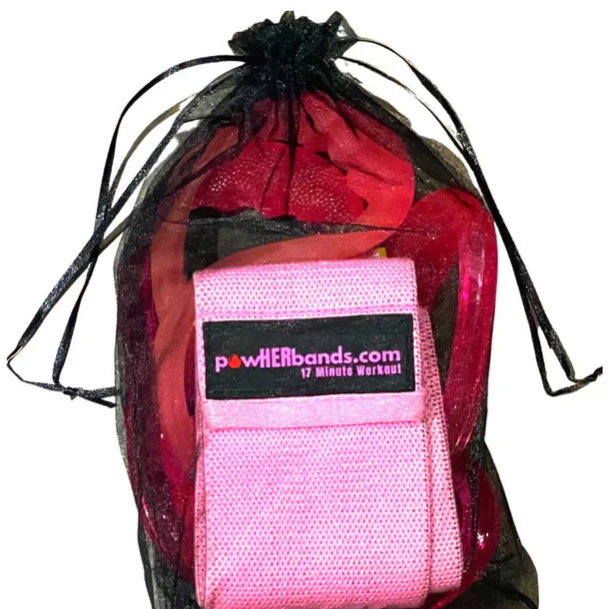 Woman training in park using Jumpsport resistance bands on trampoline