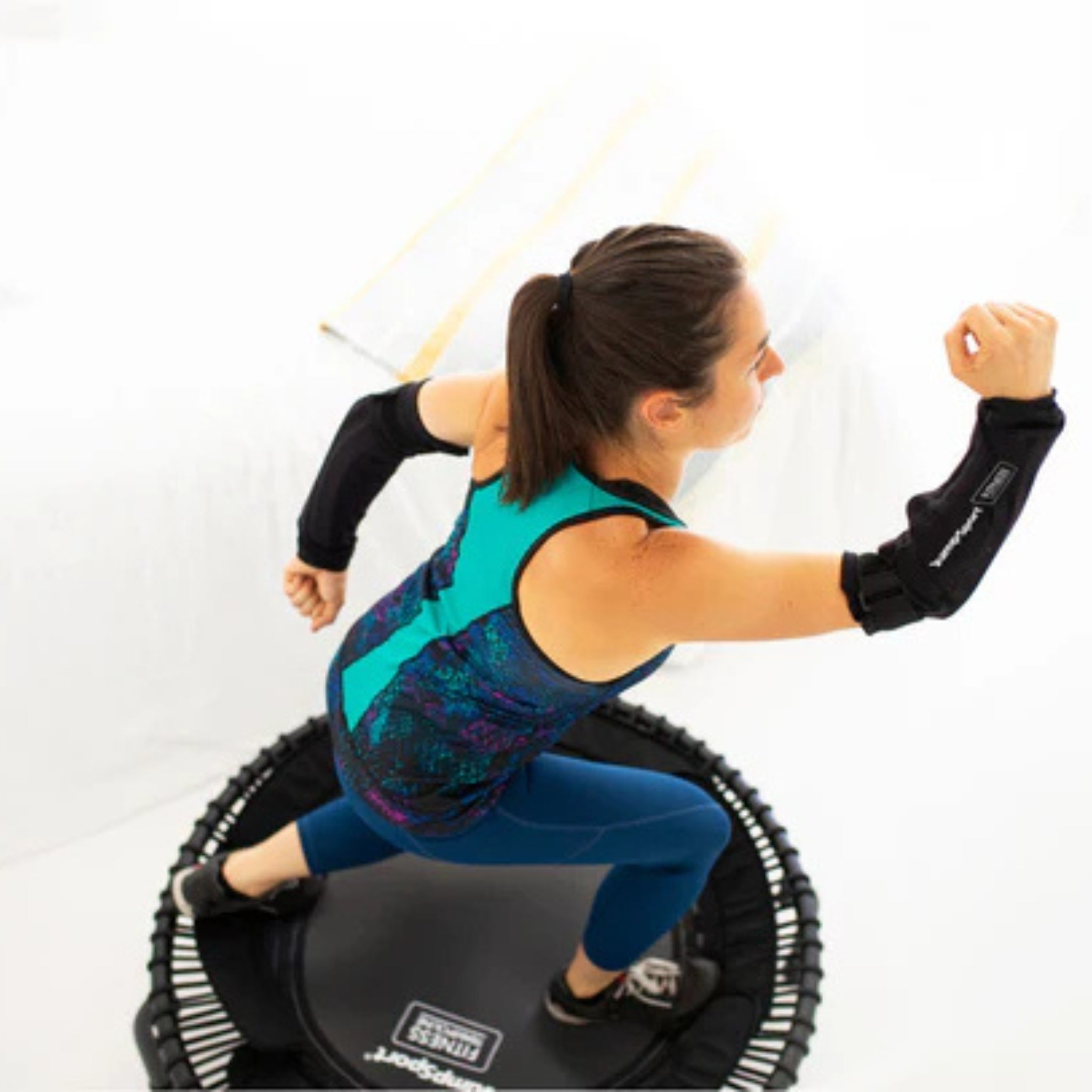 Group fitness class with Jumpsport trampoline handlebar covers for stability