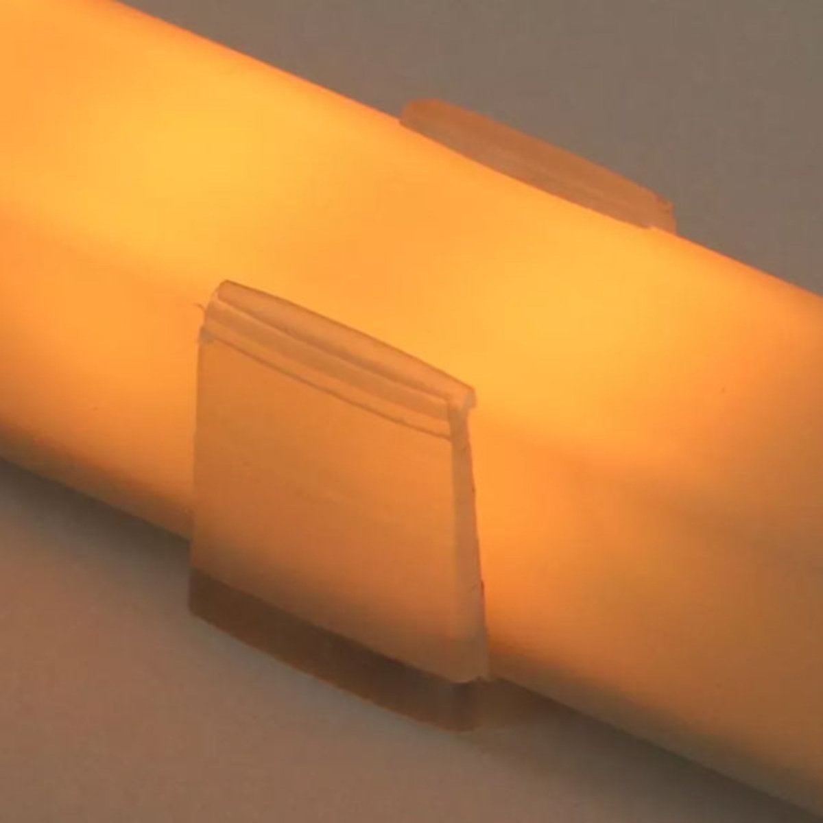 Leisurecraft 72-inch Lighting Set LED light tube shown in use, emitting a warm amber glow to create a soft sauna atmosphere.