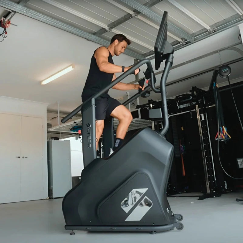 Individual using stair climber by STEPR as part of a strength focused wellness routine and personalized wellness journey.