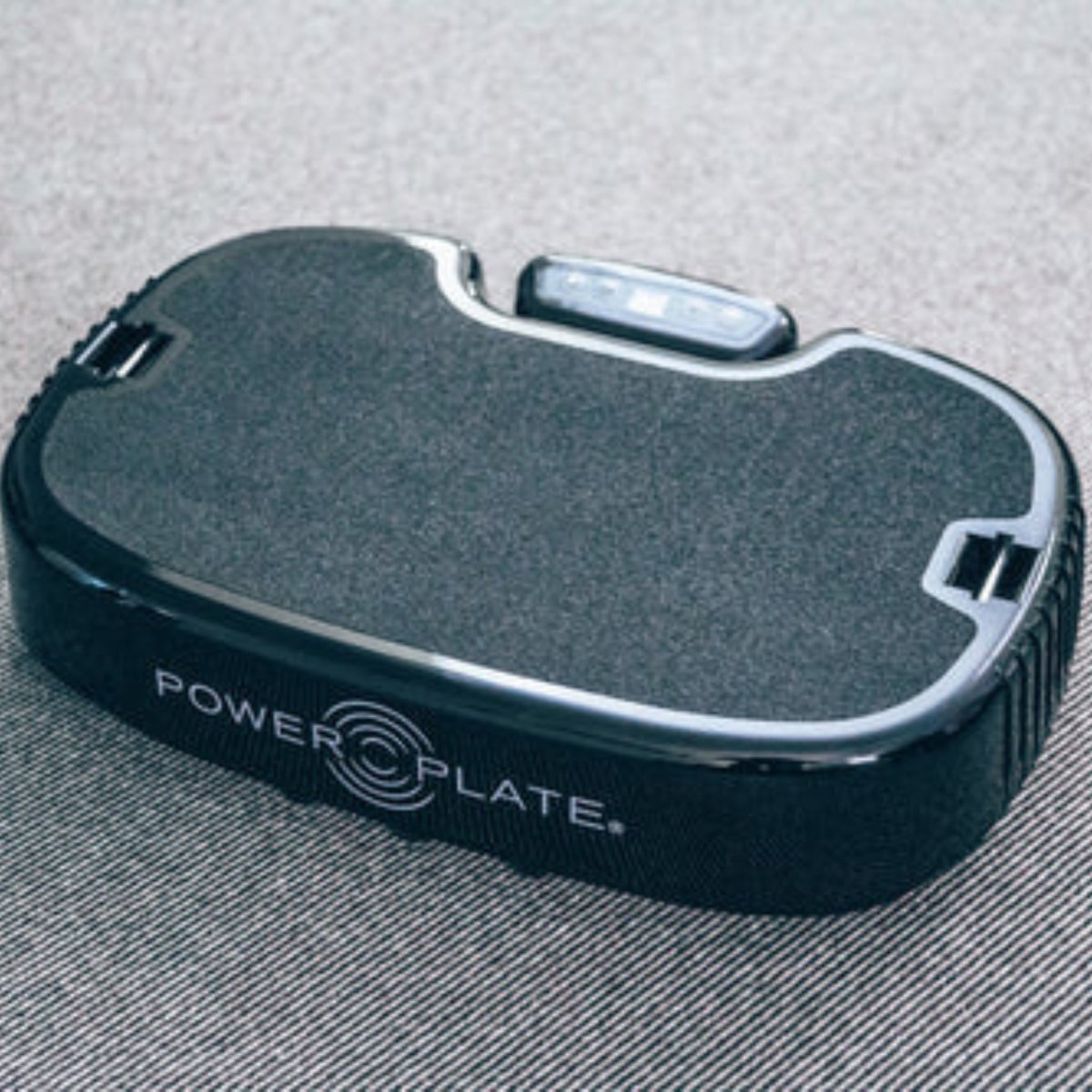Top angle of Power Plate Personal vibration platform highlighting textured surface
