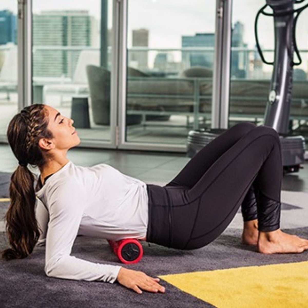 Power Plate black vibrating foam roller designed for full-body recovery and deep tissue therapy