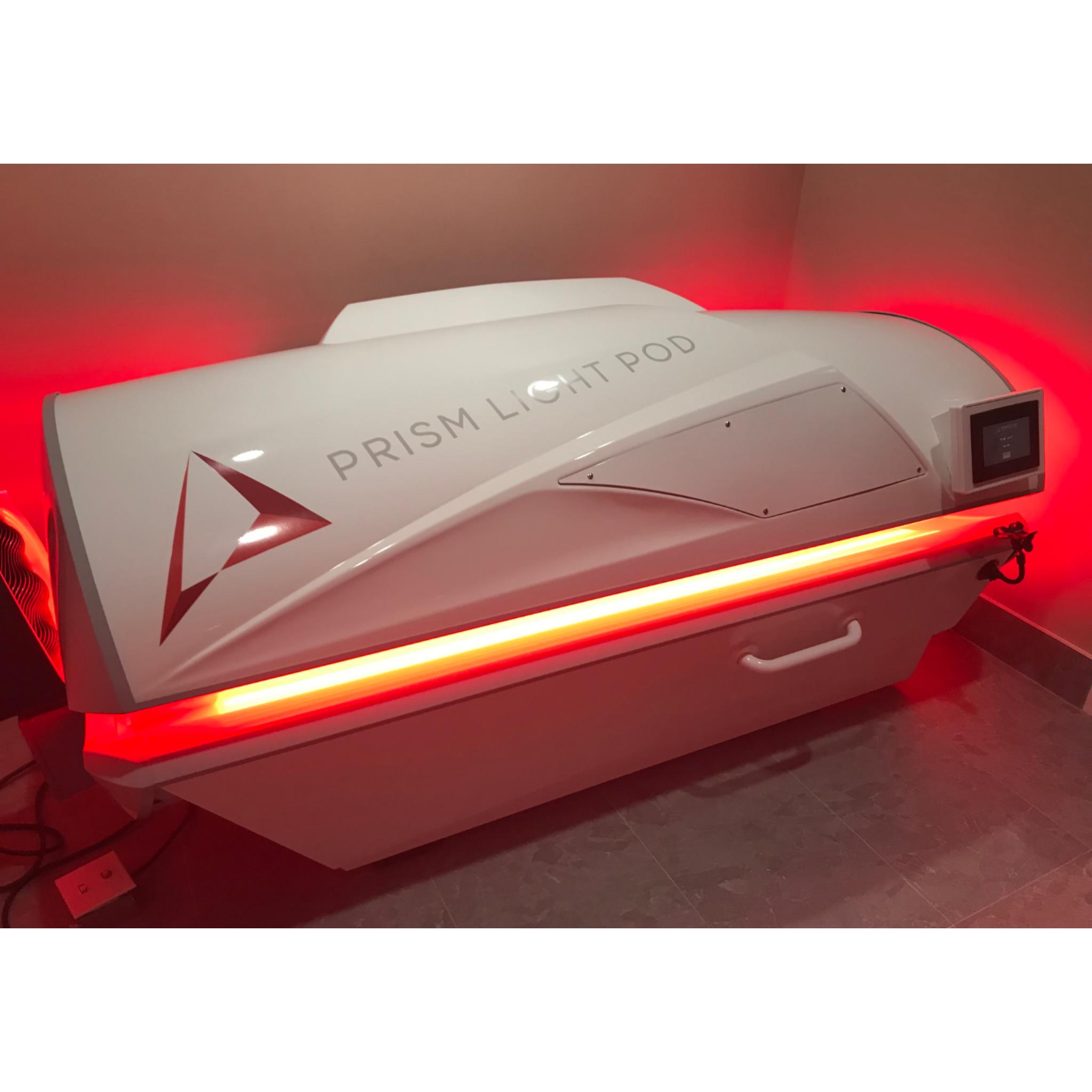 Prism Light Pod closed system with red light therapy panels glowing for full-body recovery and wellness