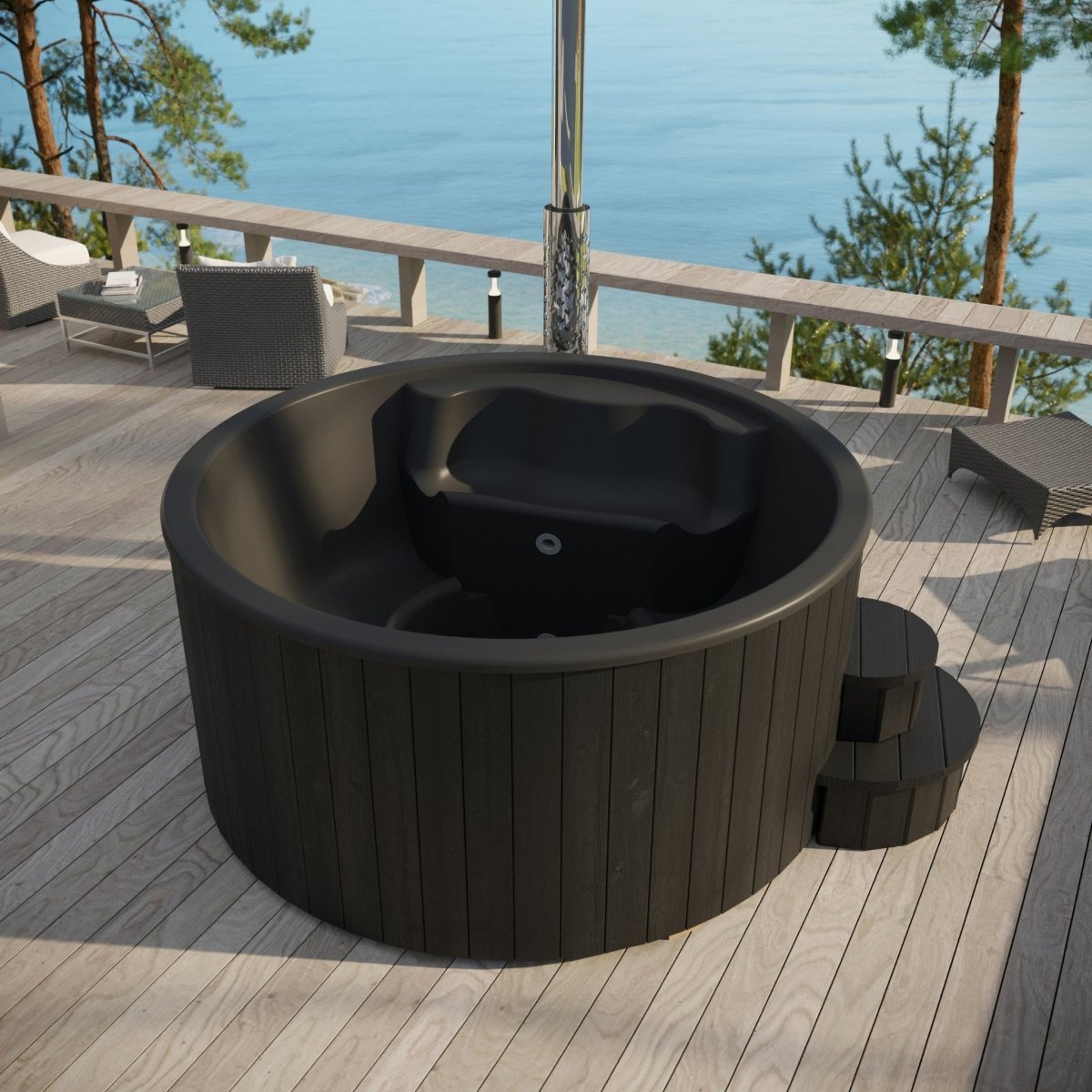 SaunaLife Model S4B round black wood hot tub with scenic ocean backdrop.