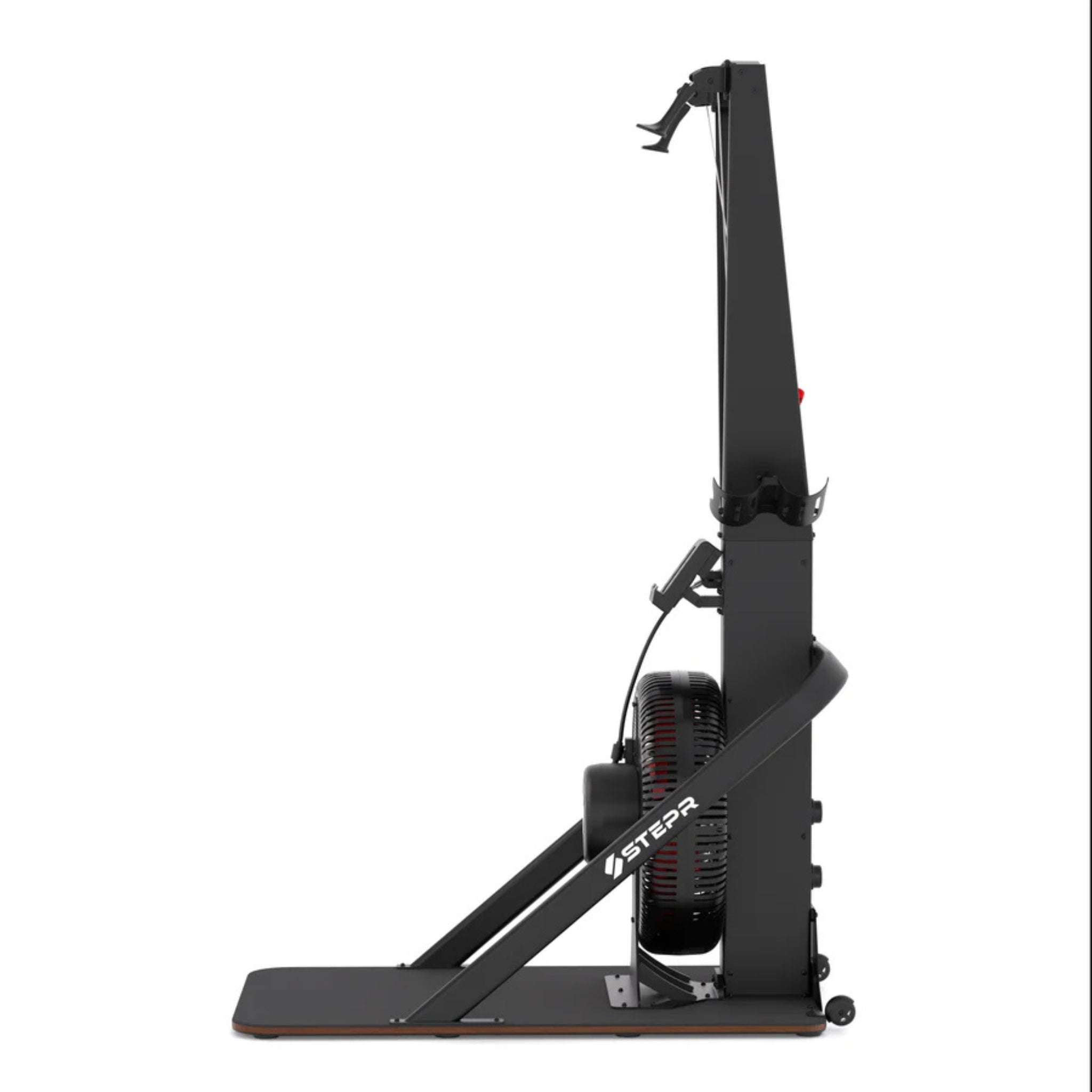 Athlete using STEPR vertical climber fitness machine in modern gym setting