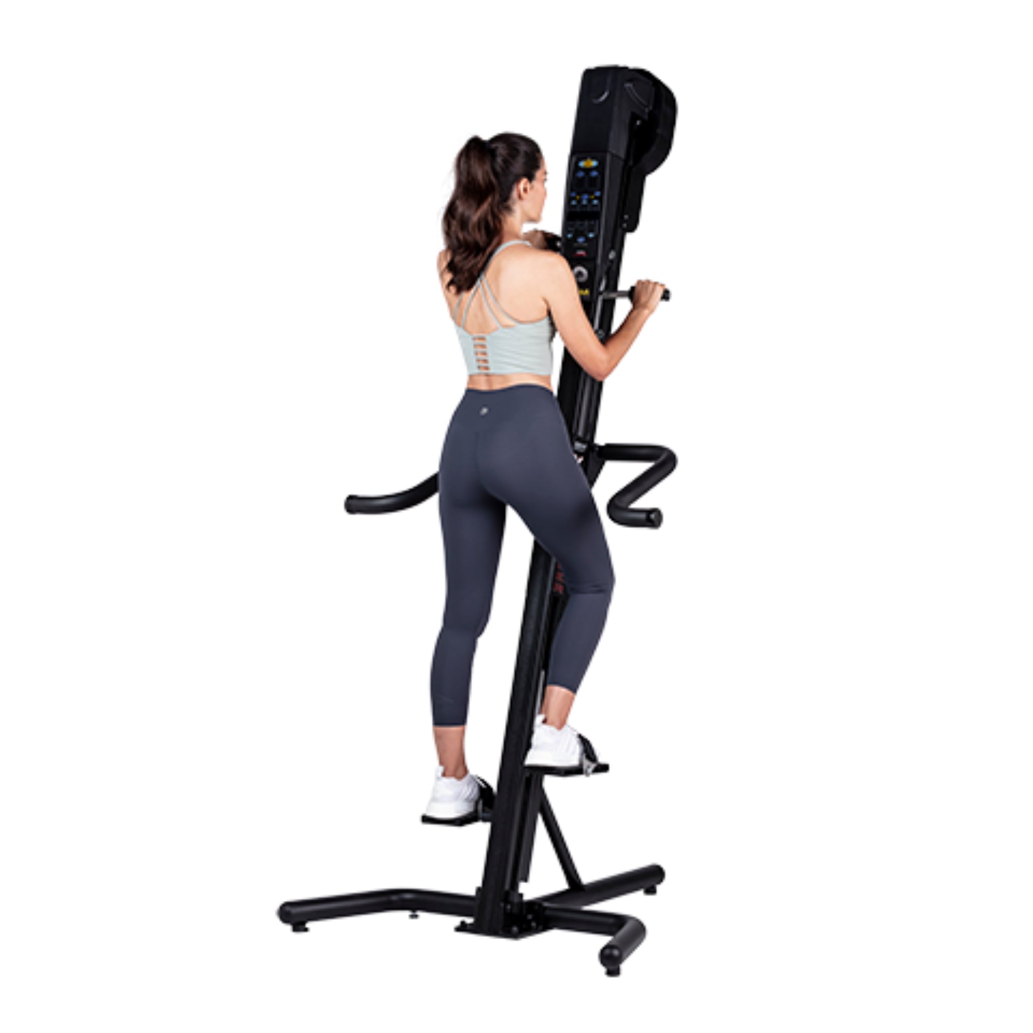 Woman exercising on the VersaClimber SM-M Magnetic in regular black finish, demonstrating full-body zero-impact cardio and strength training.