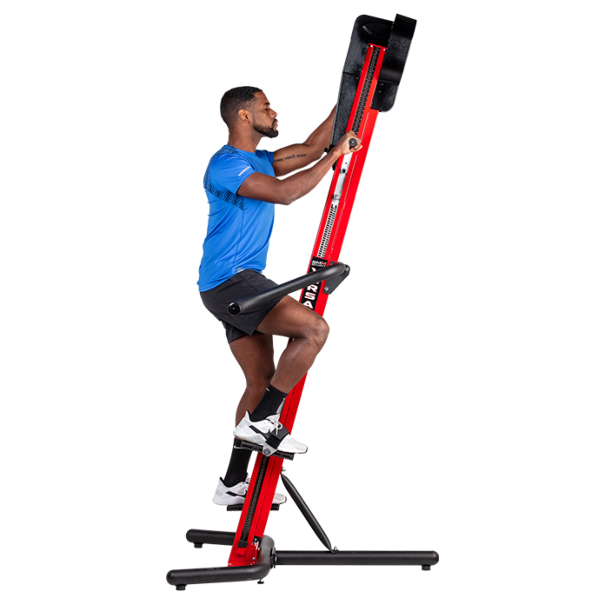 Man exercising on the VersaClimber SM-M Magnetic in red and black finish, performing full-body zero-impact cardio and strength training.