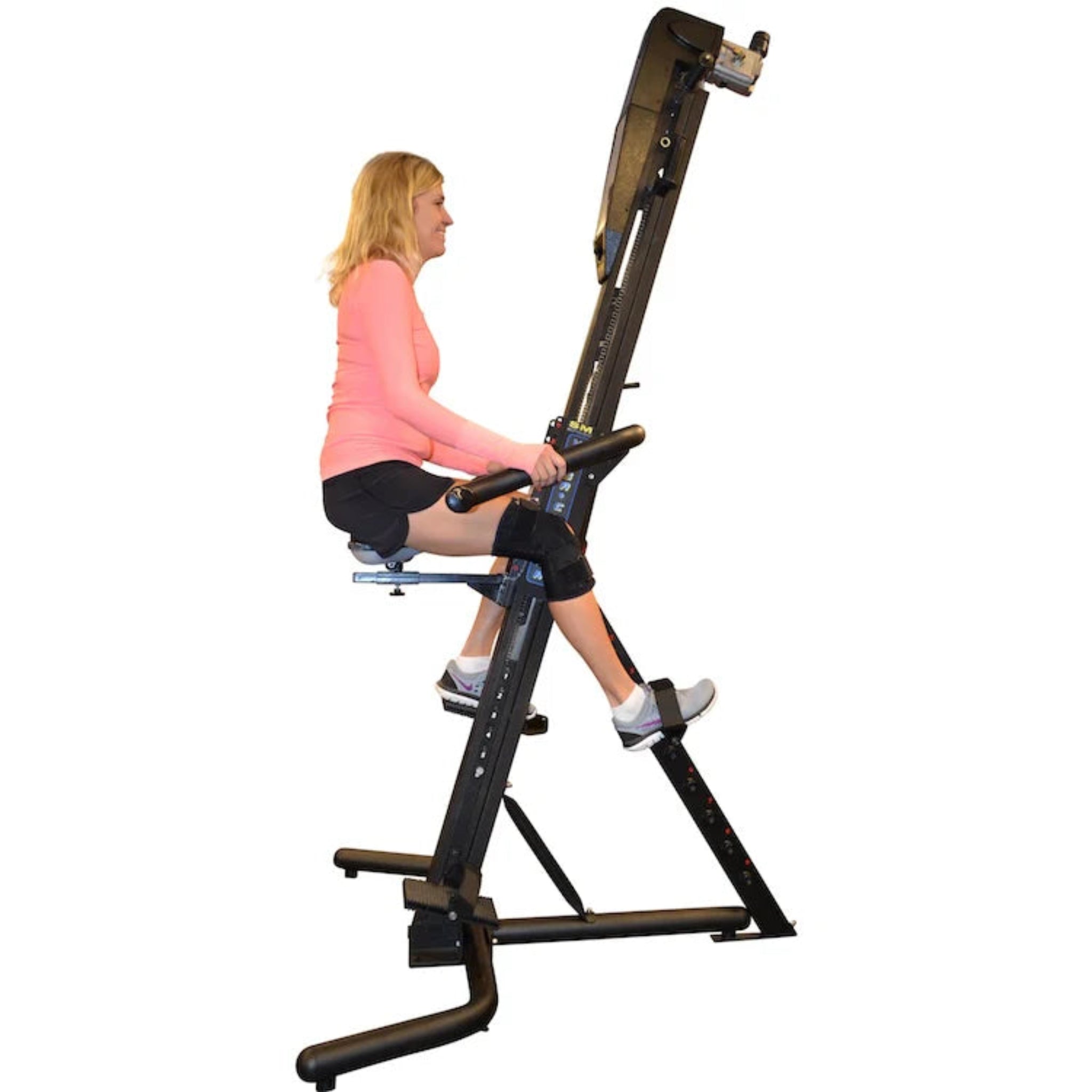 Woman exercising on the VersaClimber SRM Sport Rehab Model, a specialized vertical climbing machine designed for rehabilitation, low-impact cardio, and full-body training.