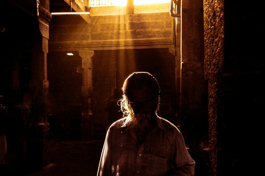 man standing in an ancient temple