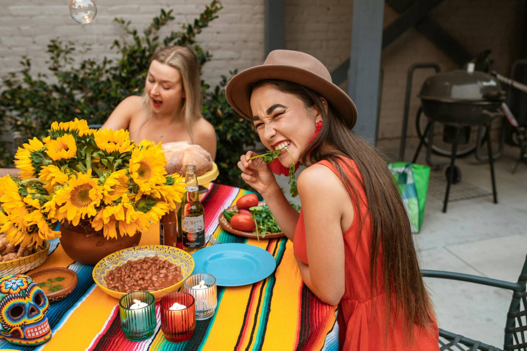 two women eating heathy food and considering getting a gut testing kit