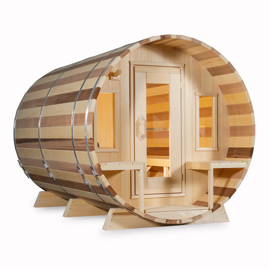 Leisurecraft Canadian Timber barrel sauna in natural wood finish, displayed on a clean white background with glass door and benches inside, highlighting handcrafted quality