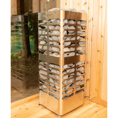 Homecraft Revive sauna heater with stainless steel frame and stacked stones, placed on a wooden floor against a cedar wall
