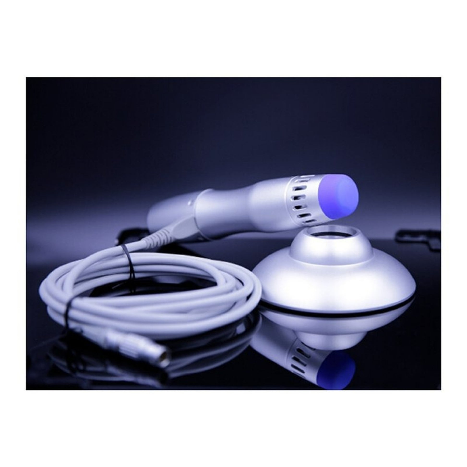 Close-up of Oceanus America PhysioPRO Shockwave Therapy Device handheld probe with cable on dark background