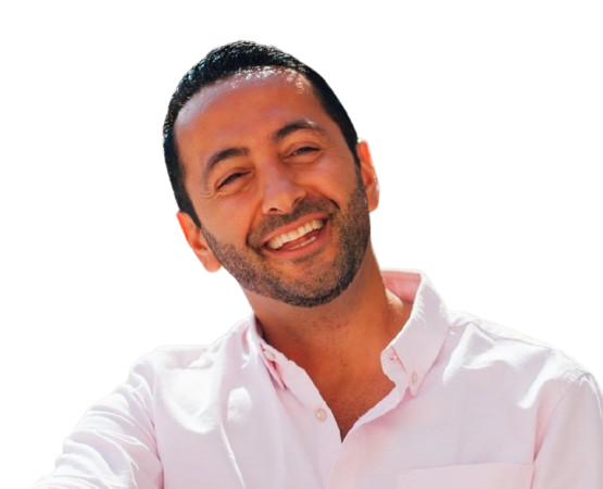 Man wearing a light pink shirt against a white background