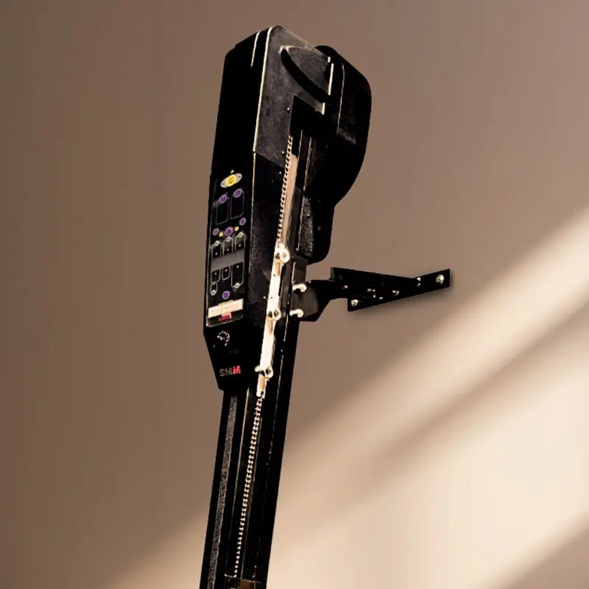 VersaClimber H/HP vertical climbing machine digital console with performance tracking buttons and control panel, displayed against a beige wall background