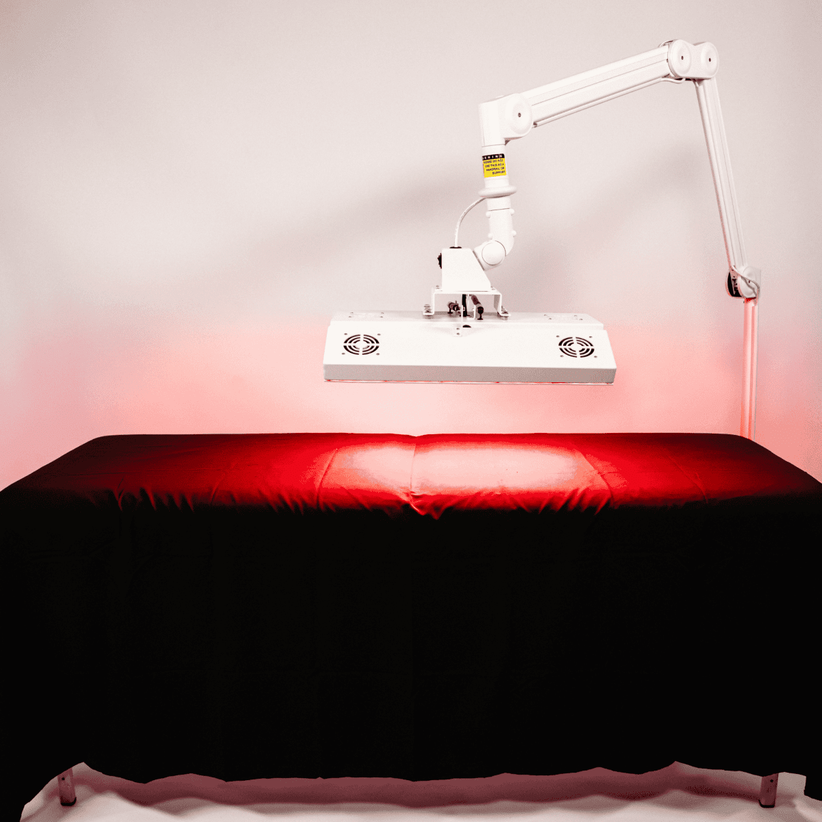 ApolloARC Premier Red Light Therapy System with adjustable arm for skin rejuvenation and recovery.