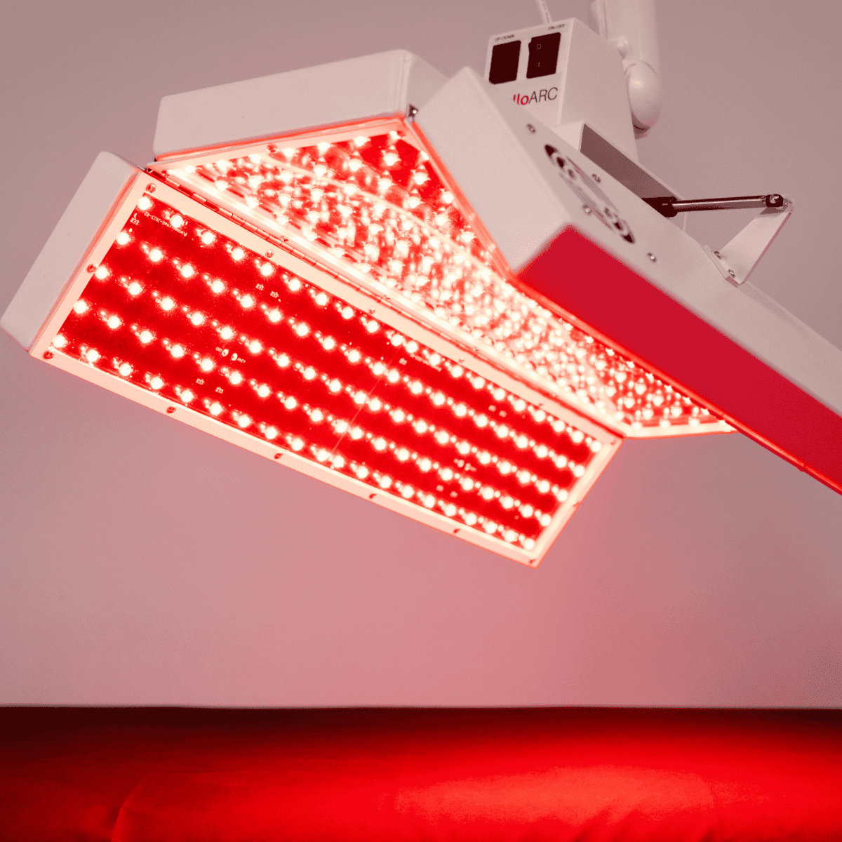 ApolloARC Premier Red Light Therapy System with adjustable arm for skin rejuvenation and recovery.