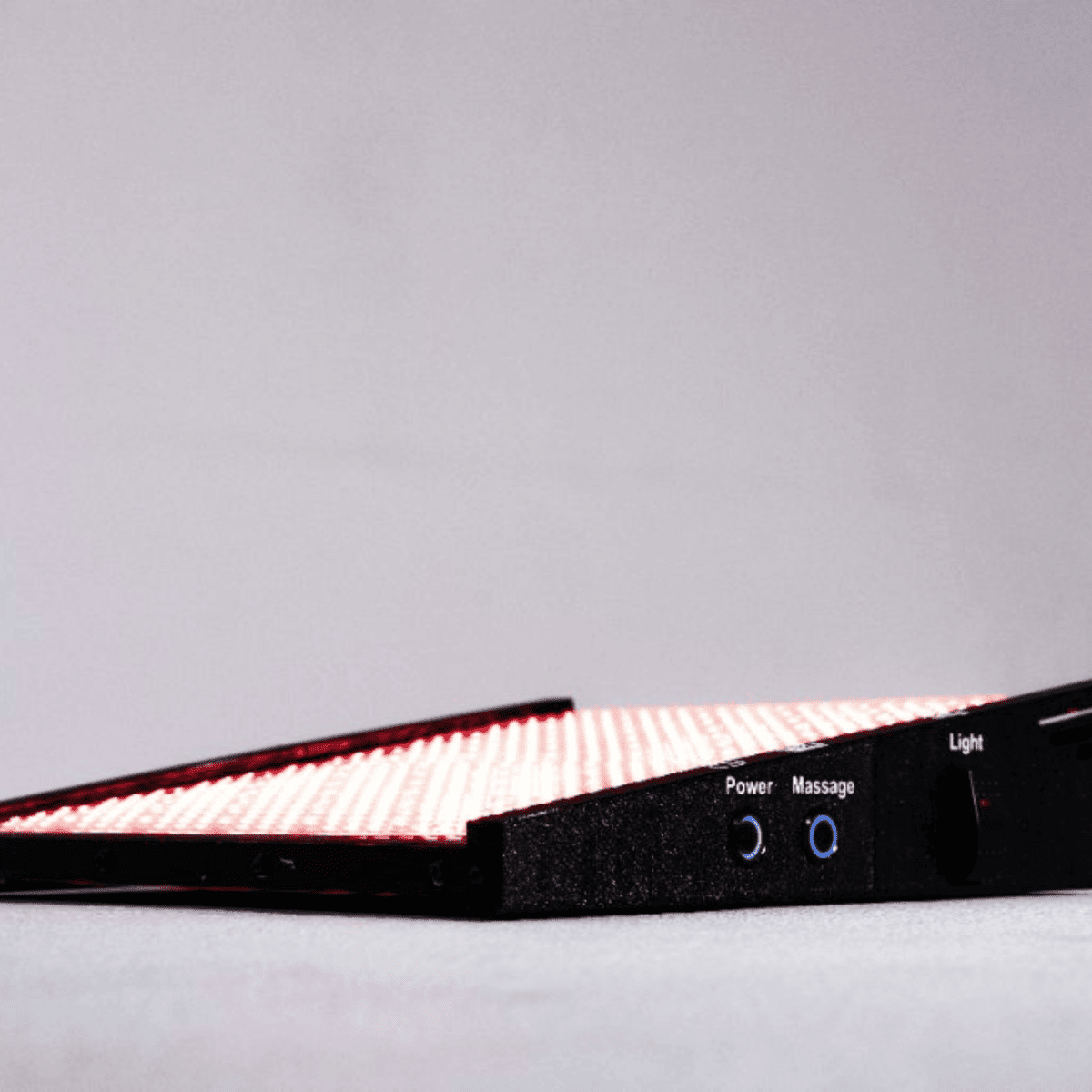 Foot Revitalizer Device showing slim profile and textured surface