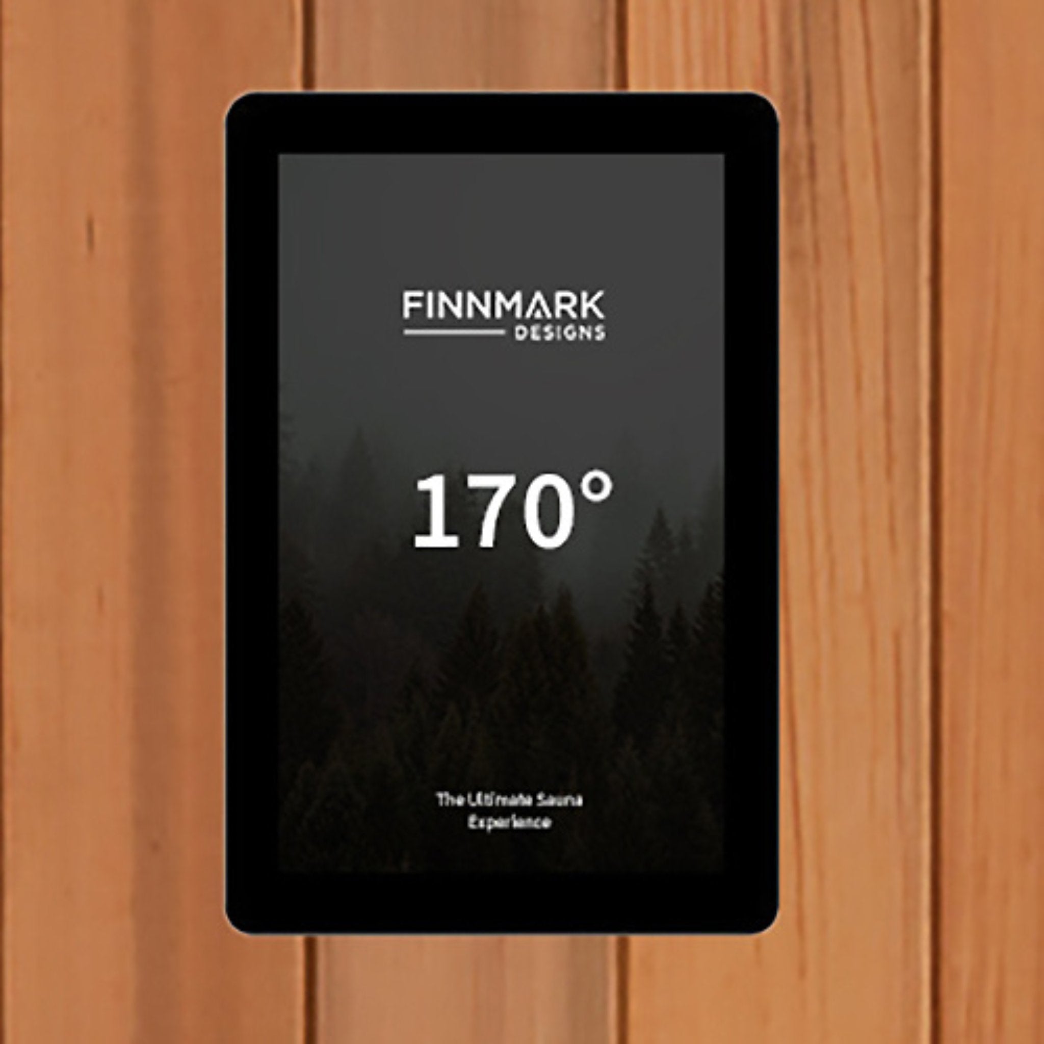 Digital control panel of the Finnmark FD-1 infrared sauna displaying a temperature reading, set against a wooden interior background.