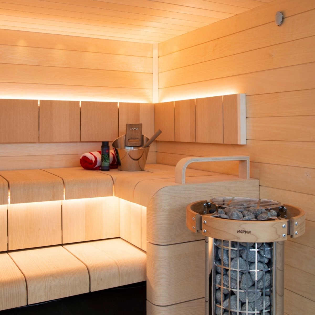Harvia Cilindro PC60 sauna heater installed inside wood sauna