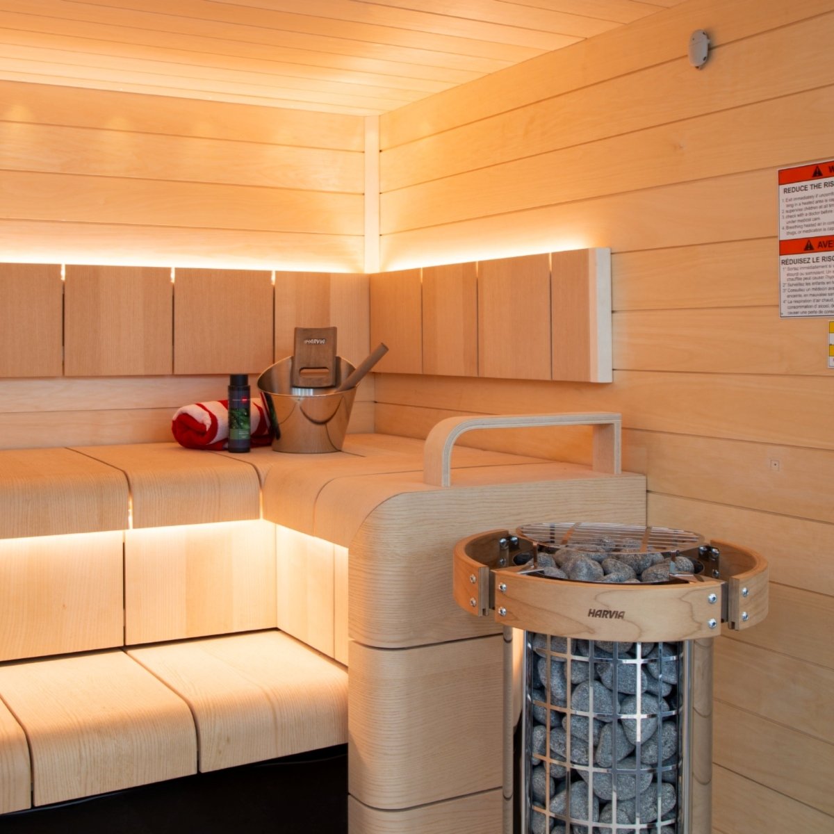 Harvia Cilindro PC90E sauna heater installed inside wood sauna