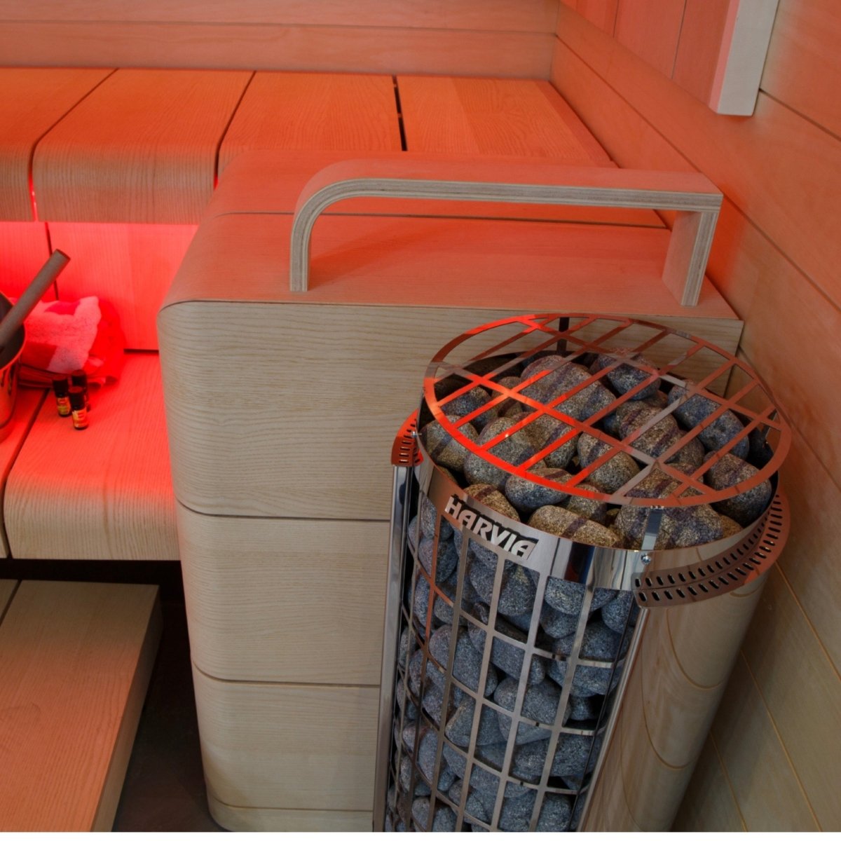 Harvia Cilindro PC90E electric sauna heater positioned against wood sauna walls