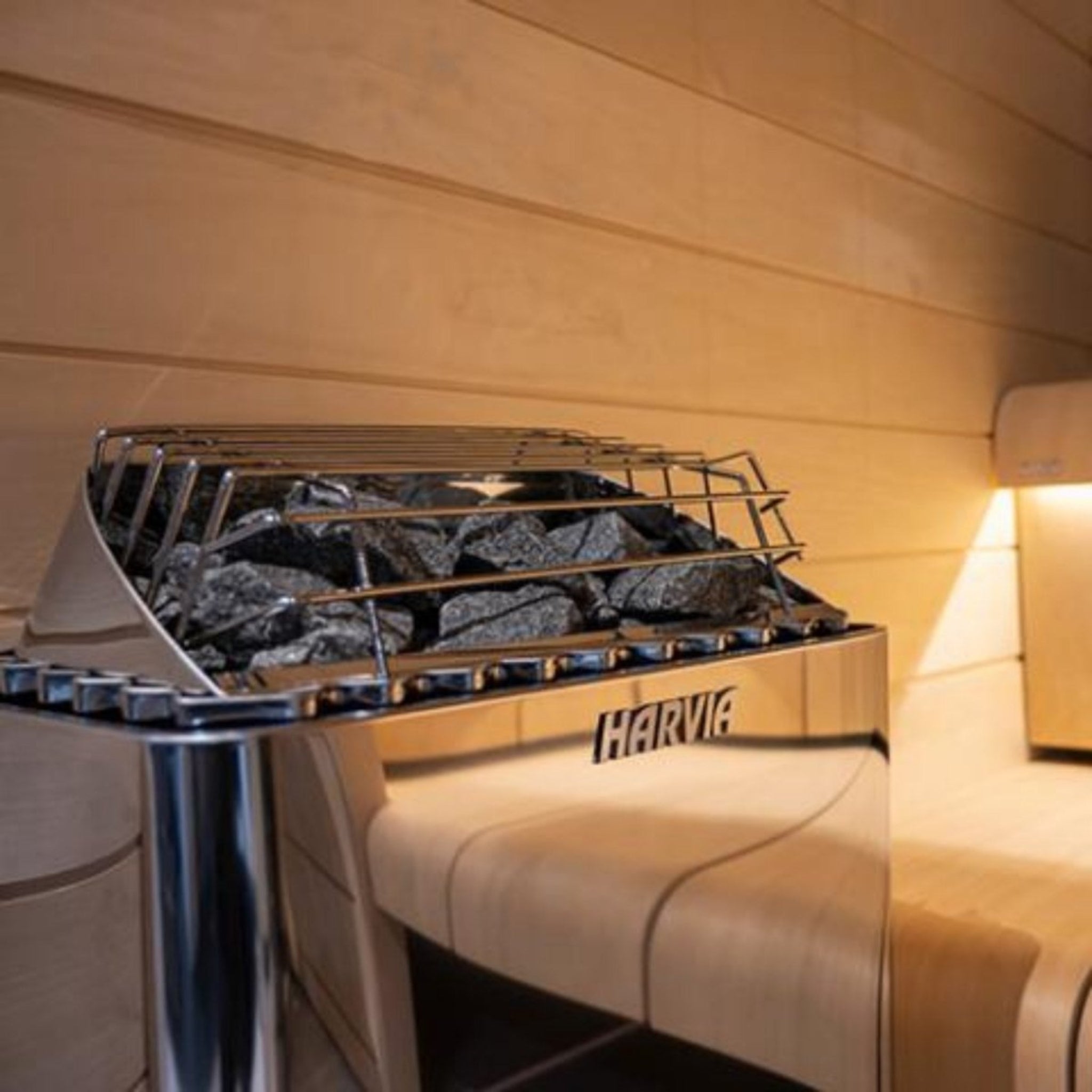 Harvia KIP45W electric sauna heater positioned against wood sauna walls