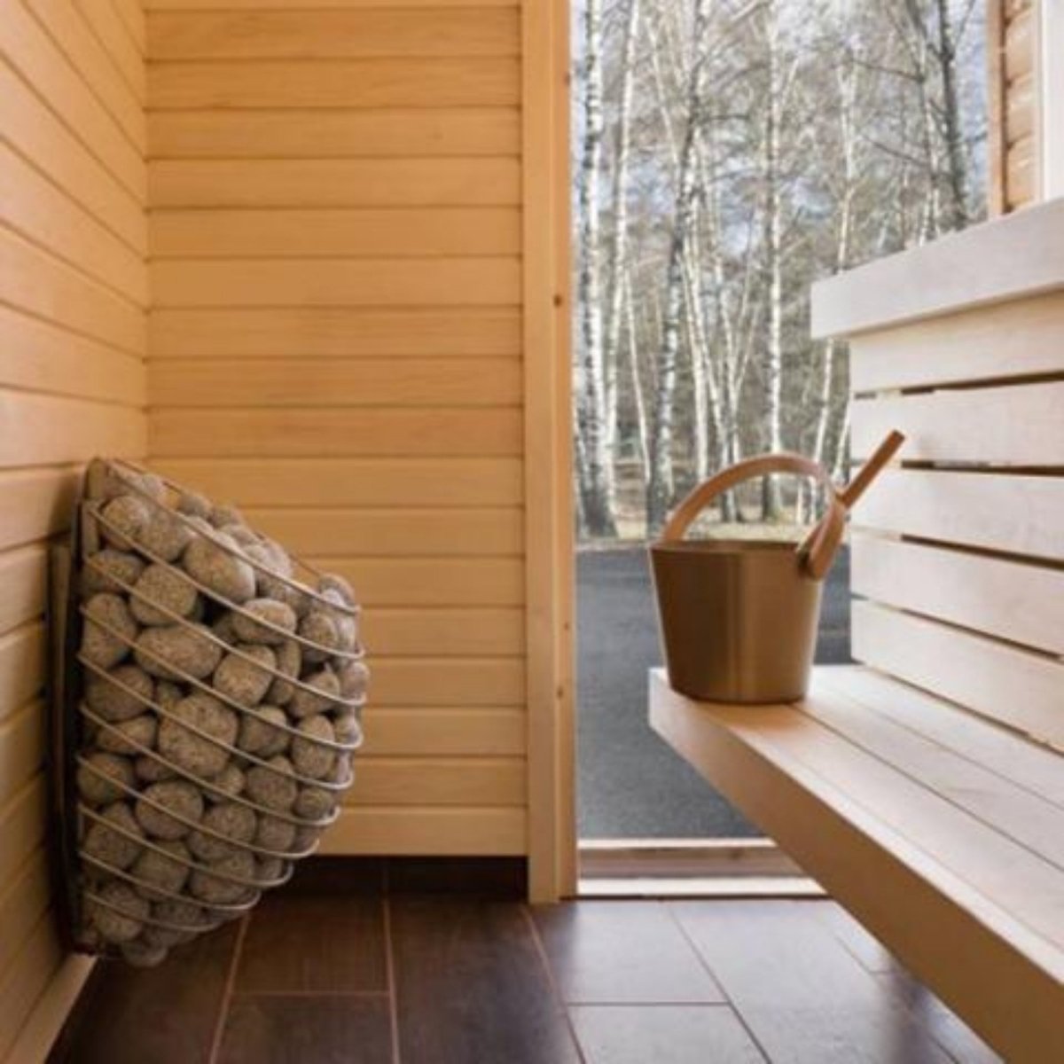HUUM DROP 9 sauna heater installed inside wood-lined sauna
