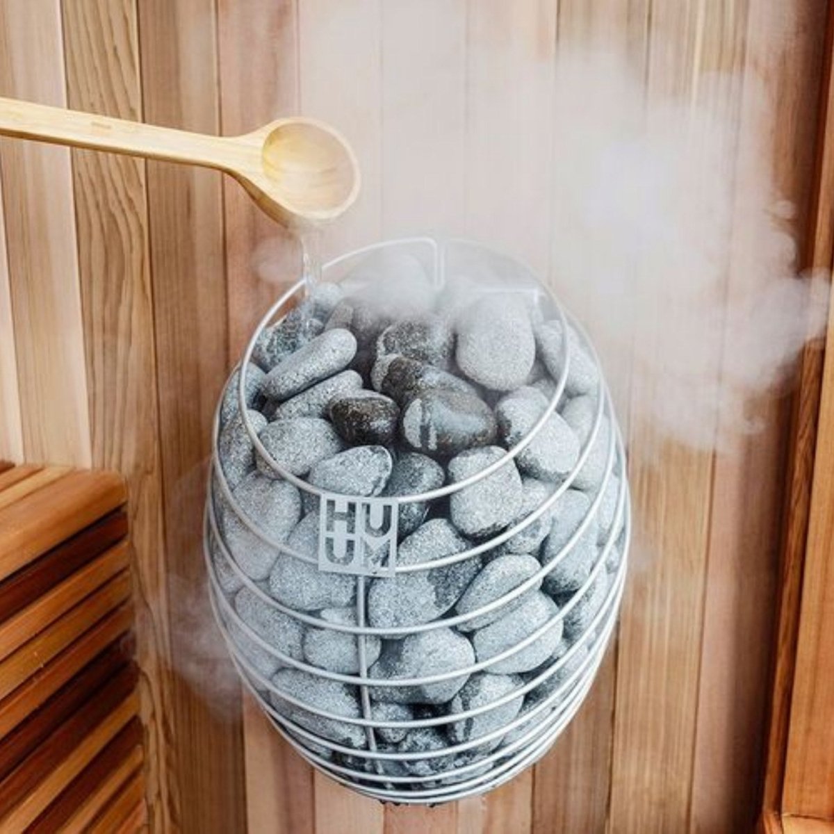 HUUM DROP 9STU sauna heater installed inside wood sauna