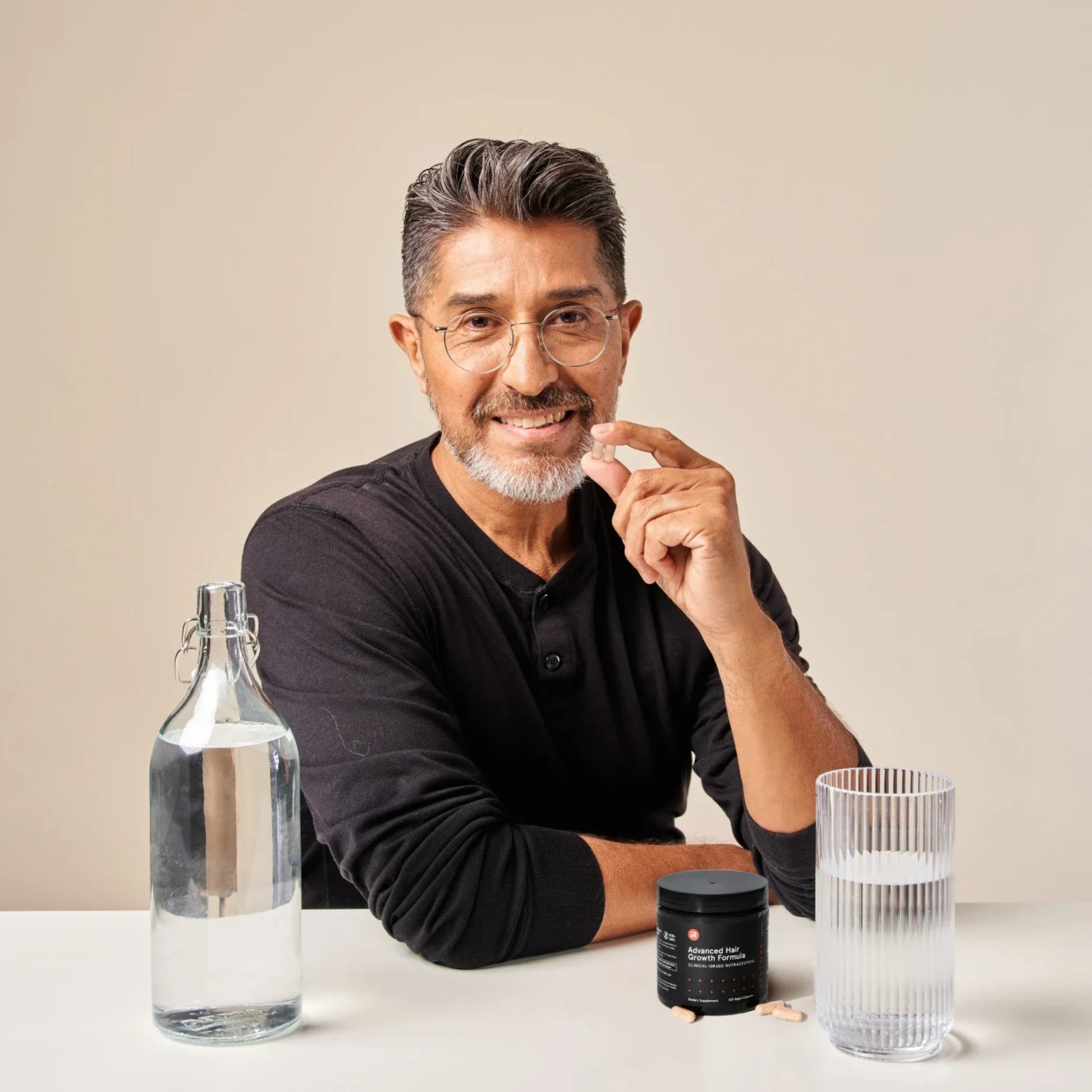 Multiple iRestore Revive Advanced Hair Growth Formula jars displayed in row