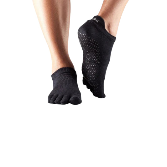 Side angle of Jumpsport black grip socks for secure trampoline workouts