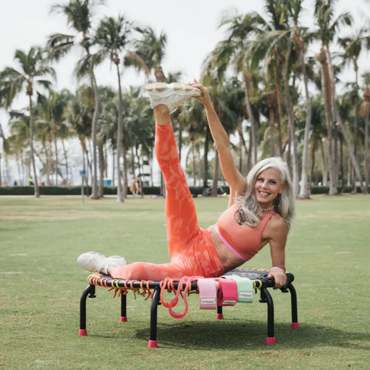Athlete exercising outdoors with Jumpsport resistance bands on trampoline