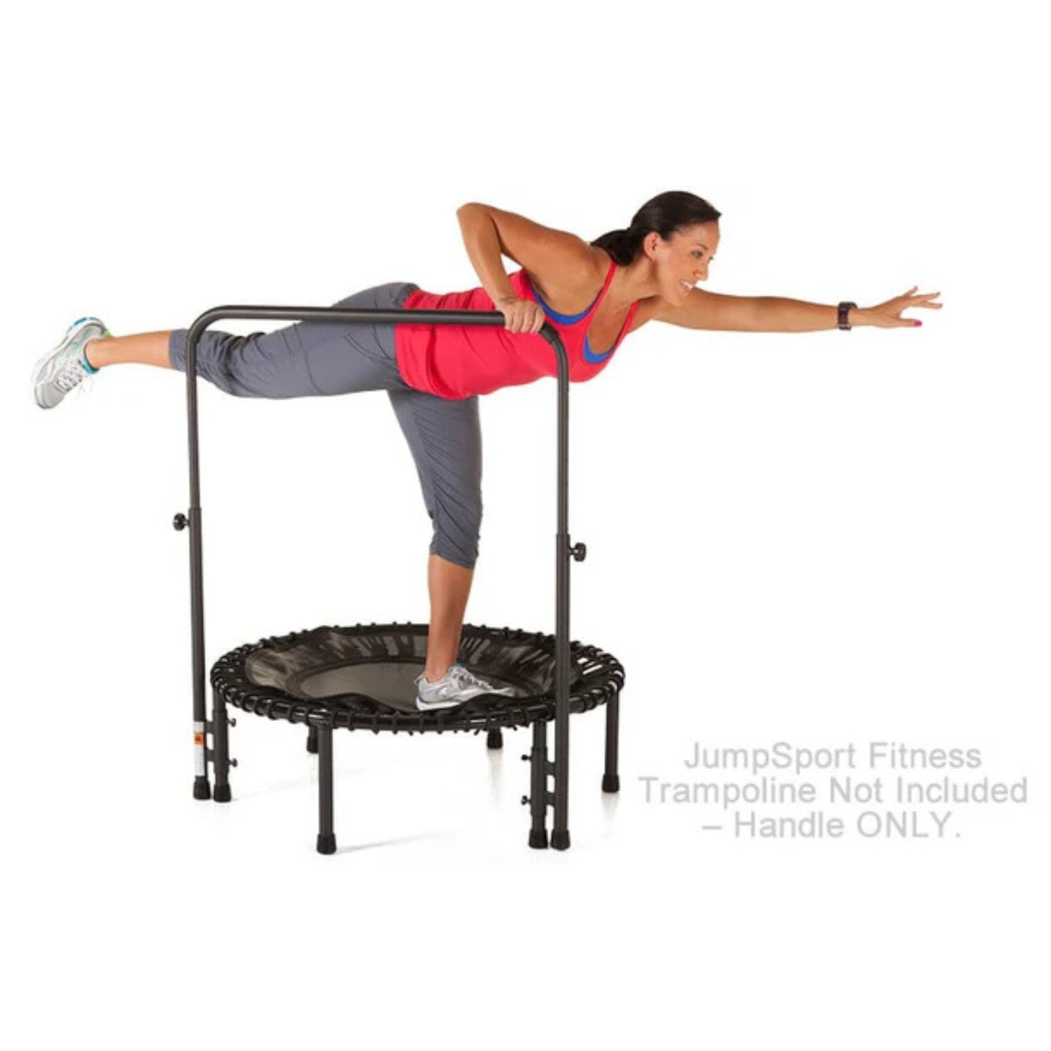 Woman exercising on Jumpsport trampoline with handlebar accessory for balance
