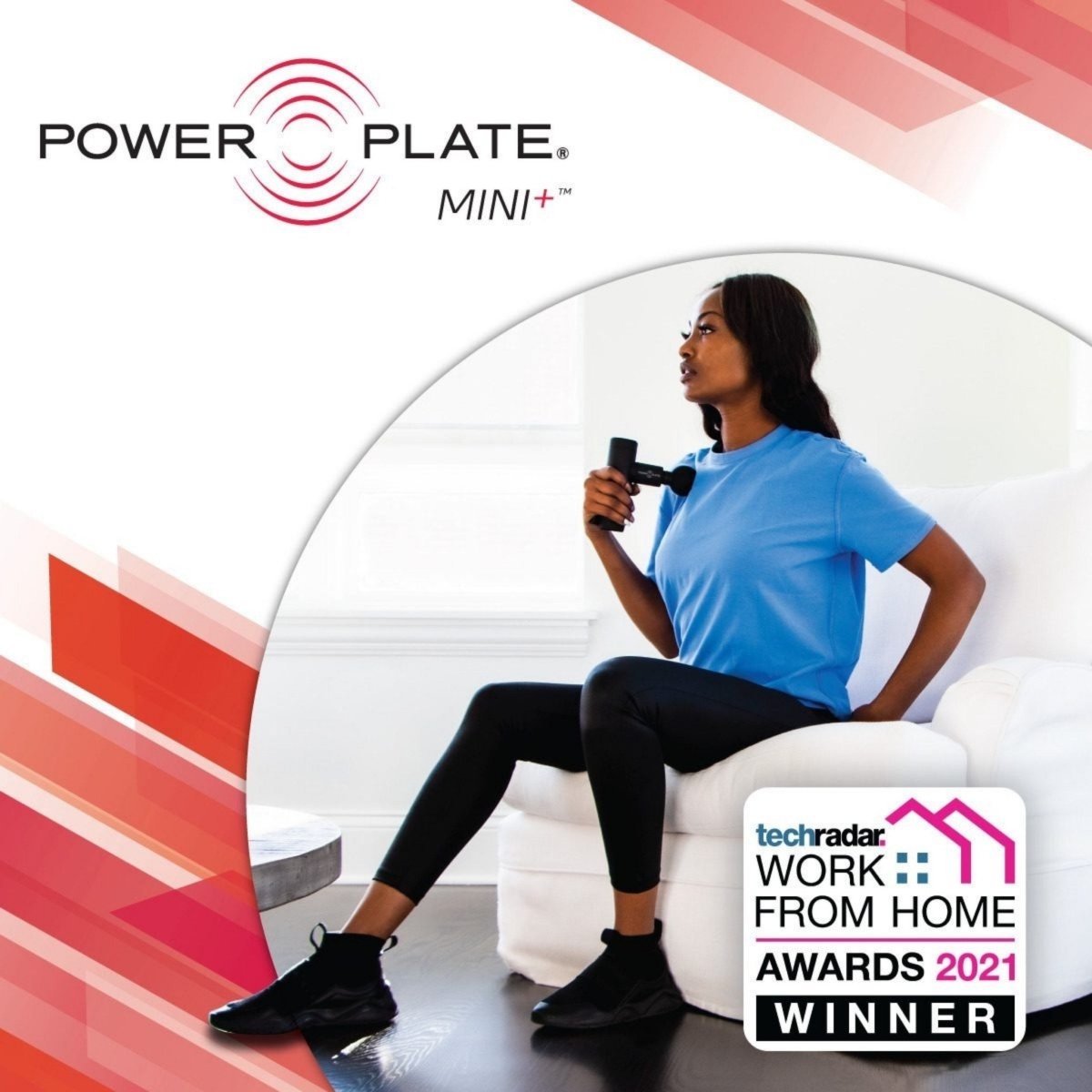 Woman using Power Plate Mini+ massage gun on shoulder, TechRadar award winner