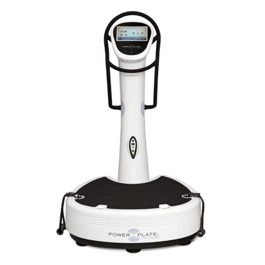 Front view of the Power Plate pro7HC white vibration training machine with touchscreen console and handlebars on a white background