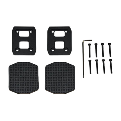 Power Plate REV bike pedal block kit including mounting plates, grip pads, bolts, and hex key