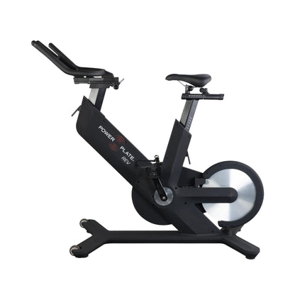 Side profile of the Power Plate REV vibration-enhanced indoor cycling bike with flywheel and ergonomic handlebars
