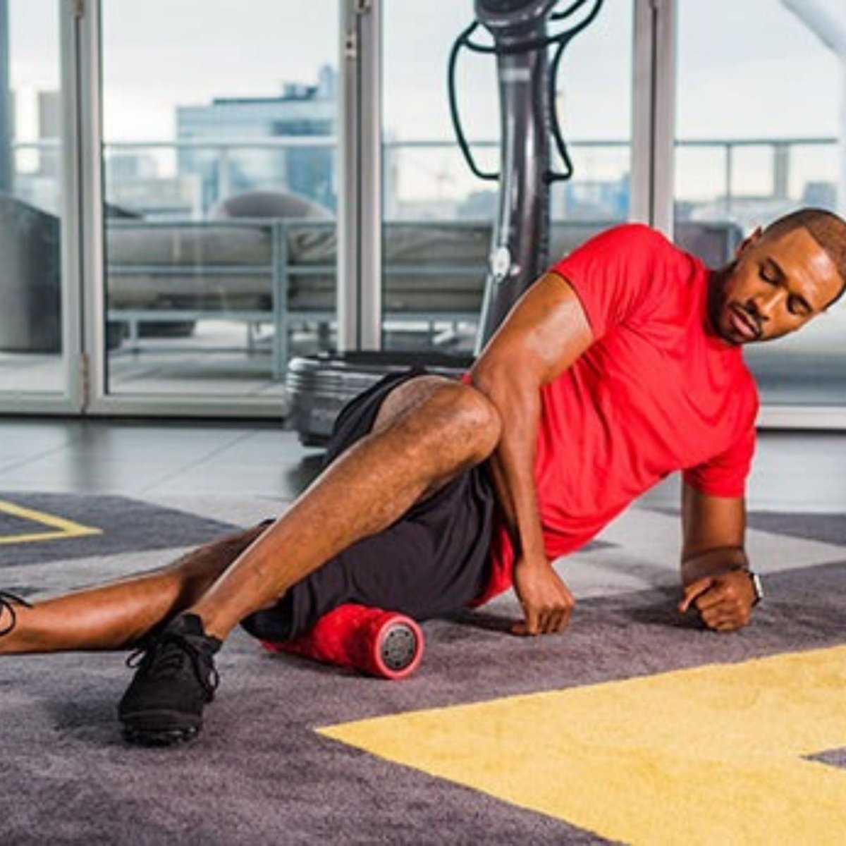 Close-up of Power Plate black vibrating foam roller with textured surface for muscle stimulation